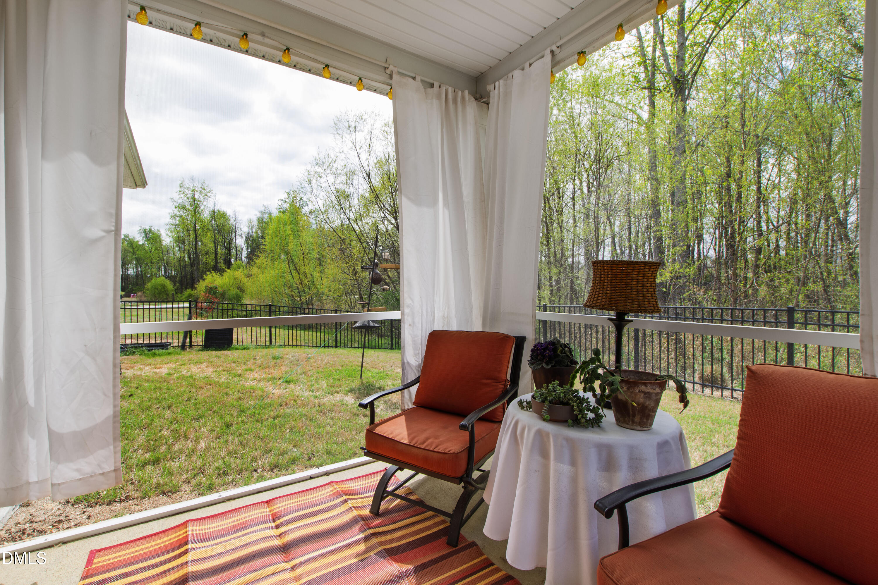 339 Summer Ranch Drive Fuquay-Varina, NC 27526 - Photo 4 of 42 a balcony with table and chairs