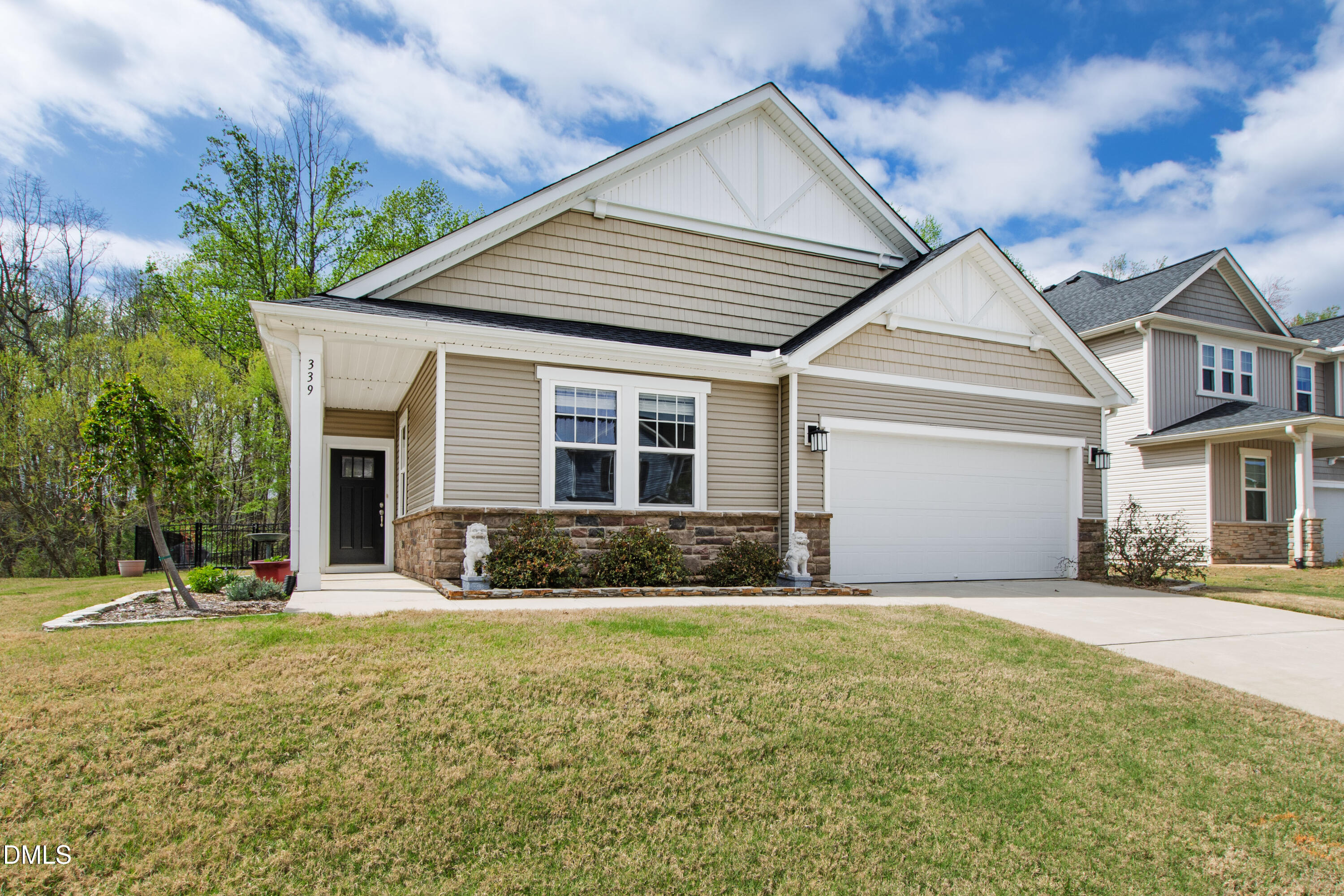 339 Summer Ranch Drive Fuquay-Varina, NC 27526 - Photo 5 of 42 a front view of a house with a yard