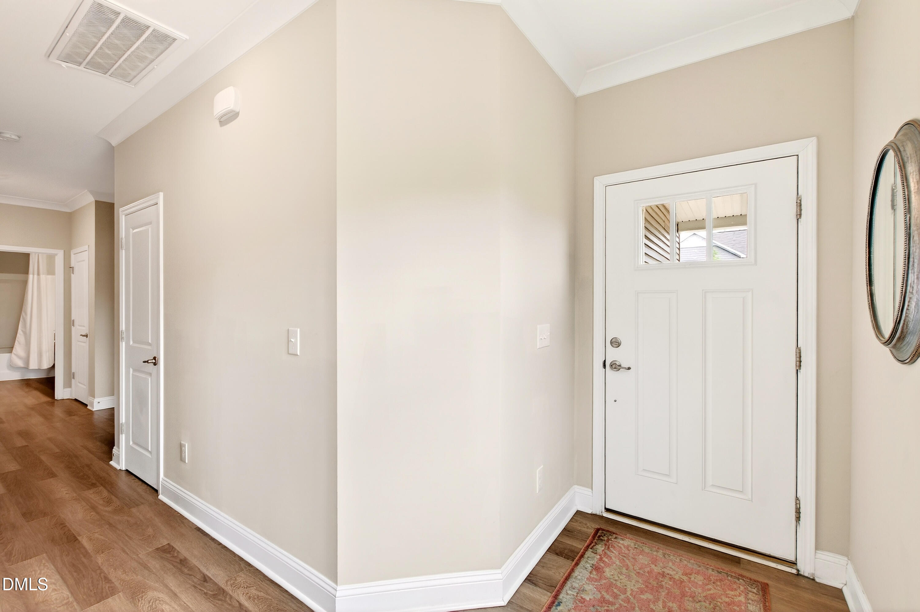 339 Summer Ranch Drive Fuquay-Varina, NC 27526 - Photo 7 of 42 a view of a hallway with wooden floor