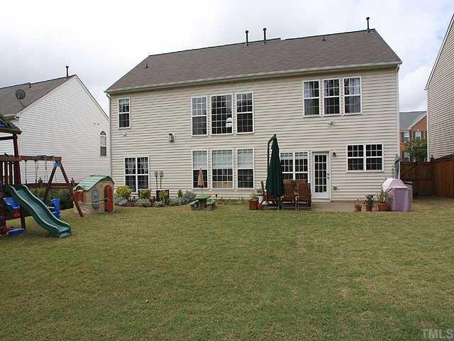 7620 Silver View Lane Raleigh, NC 27613 - Photo 12 of 12 a view of a house with a yard