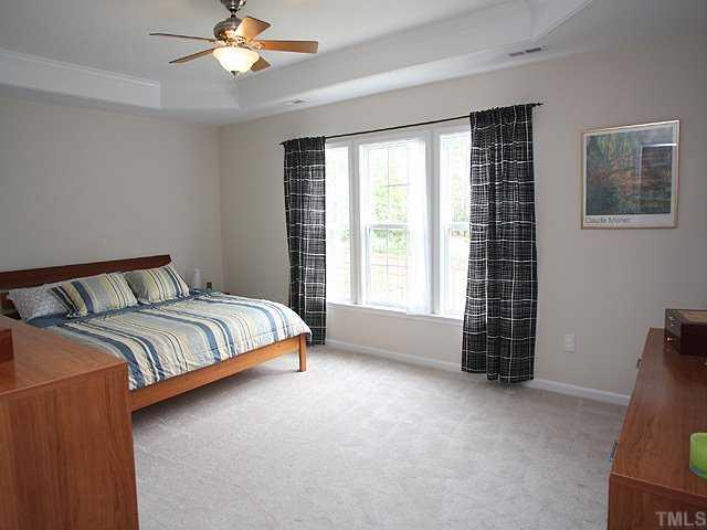 7620 Silver View Lane Raleigh, NC 27613 - Photo 6 of 12 a bedroom with a bed and a window