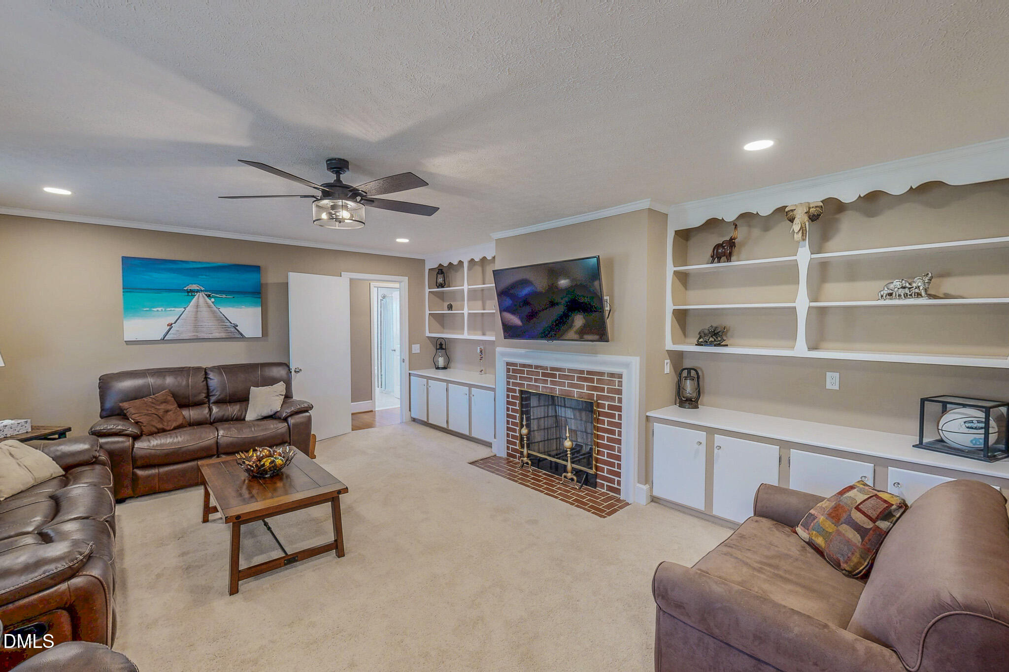12057 Hurdle Mills Road Hurdle Mills, NC 27541 - Photo 2 of 52 a living room with furniture and a fireplace