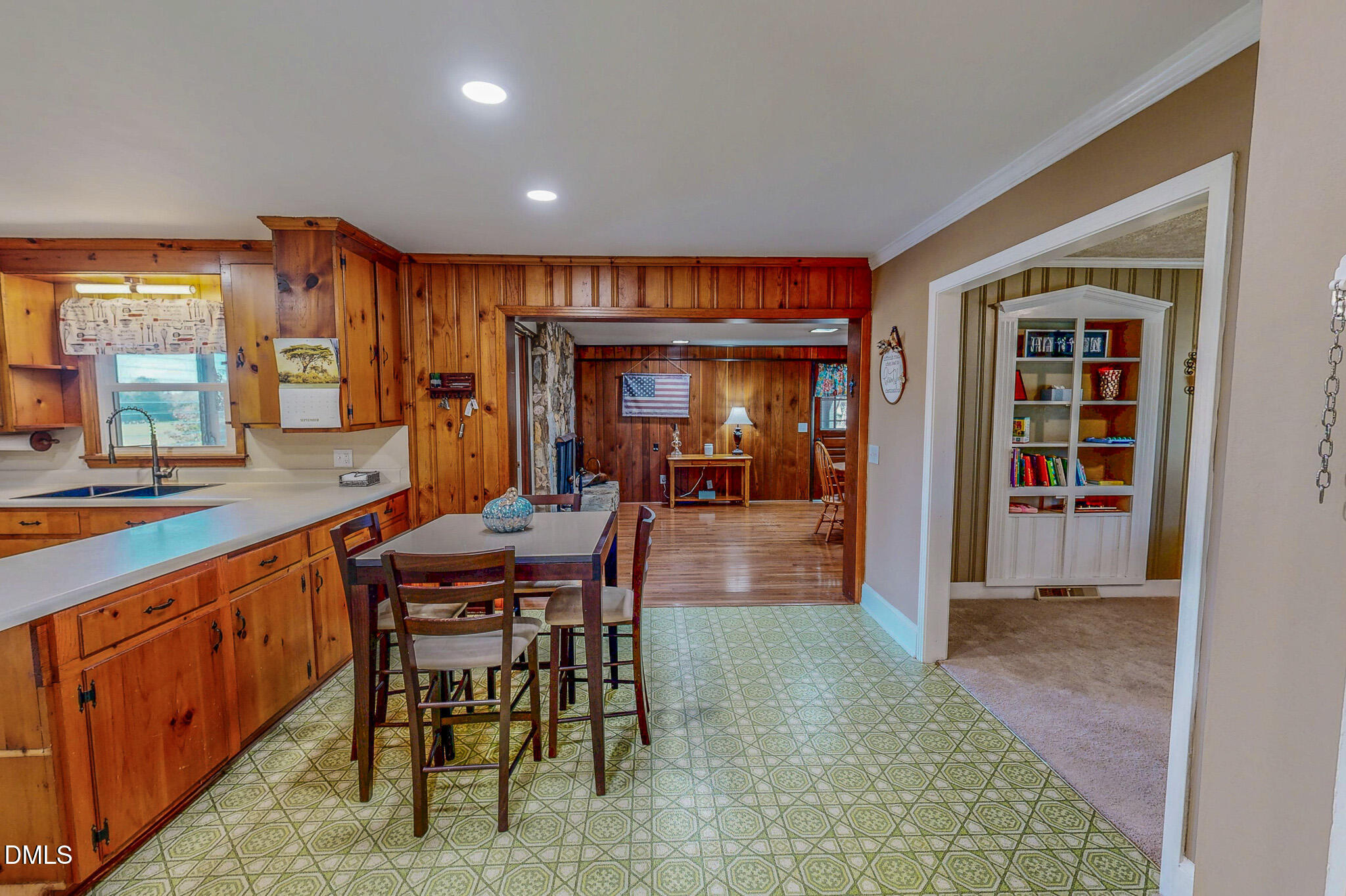 12057 Hurdle Mills Road Hurdle Mills, NC 27541 - Photo 21 of 52 a dining hall with stainless steel appliances granite countertop a table and chairs