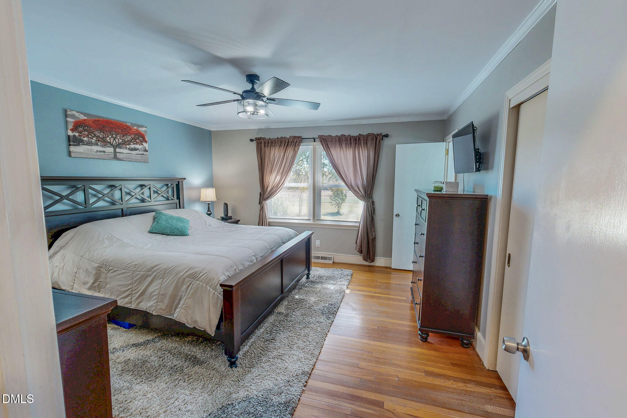 12057 Hurdle Mills Road Hurdle Mills, NC 27541 - Photo 31 of 52 a bedroom with a bed and a large window