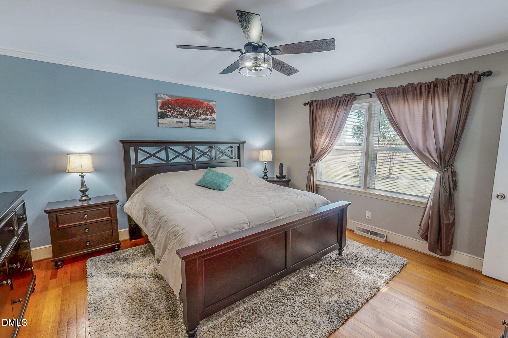 12057 Hurdle Mills Road Hurdle Mills, NC 27541 - Photo 32 of 52 a bedroom with a bed and a chandelier