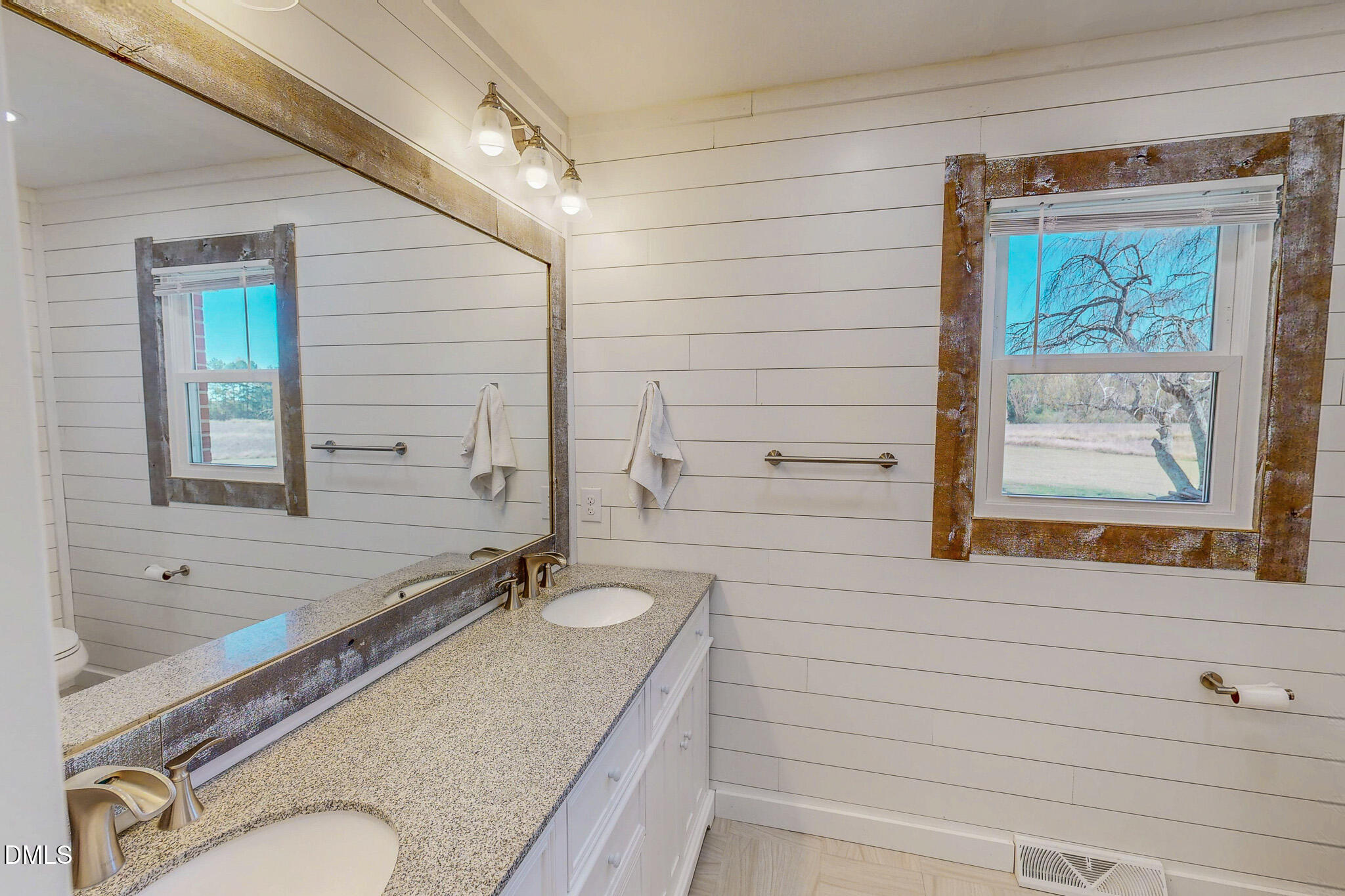 12057 Hurdle Mills Road Hurdle Mills, NC 27541 - Photo 38 of 52 a bathroom with a granite countertop sink and a mirror