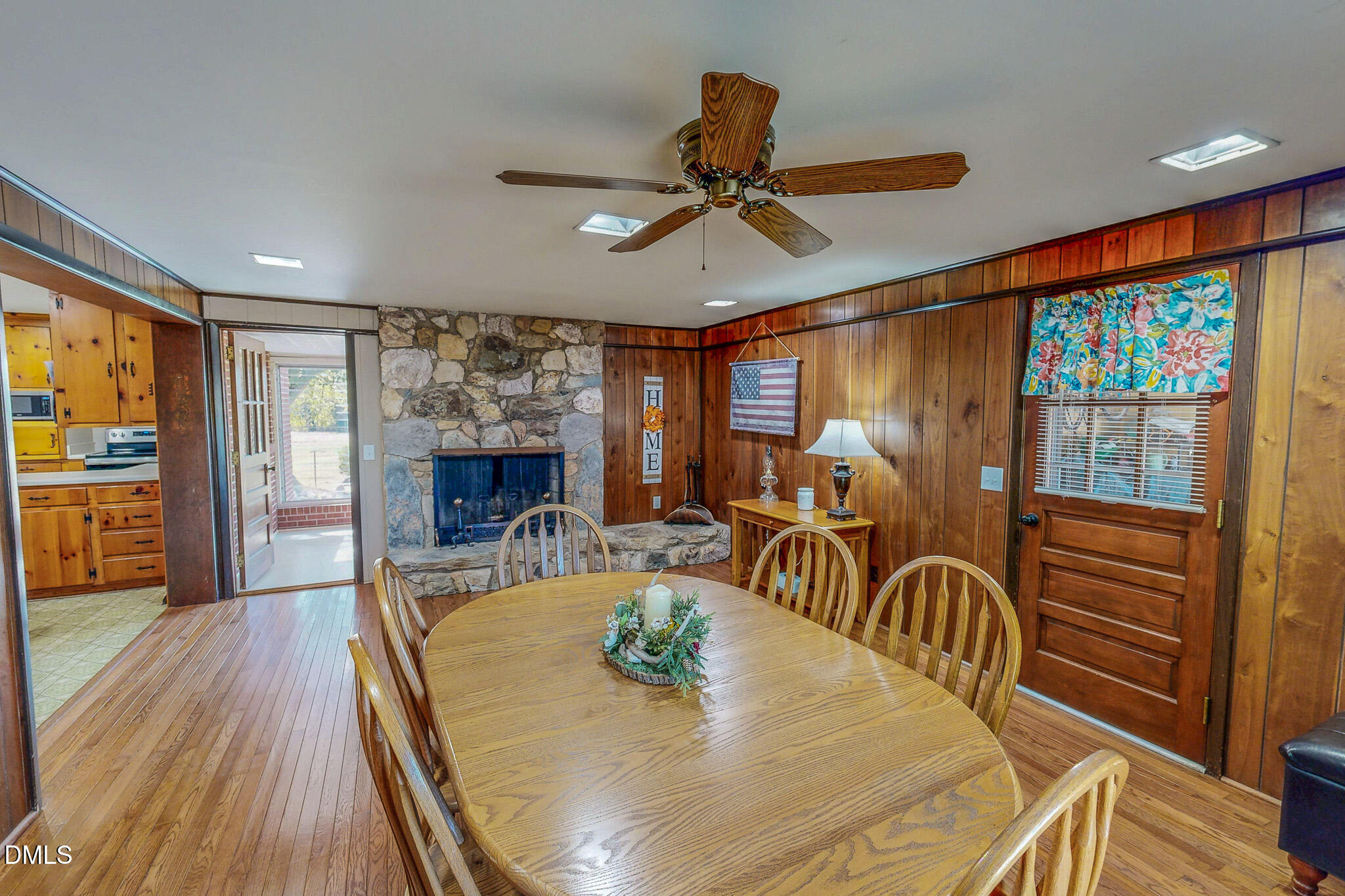 12057 Hurdle Mills Road Hurdle Mills, NC 27541 - Photo 4 of 52 a view of a dining room with furniture window and wooden floor