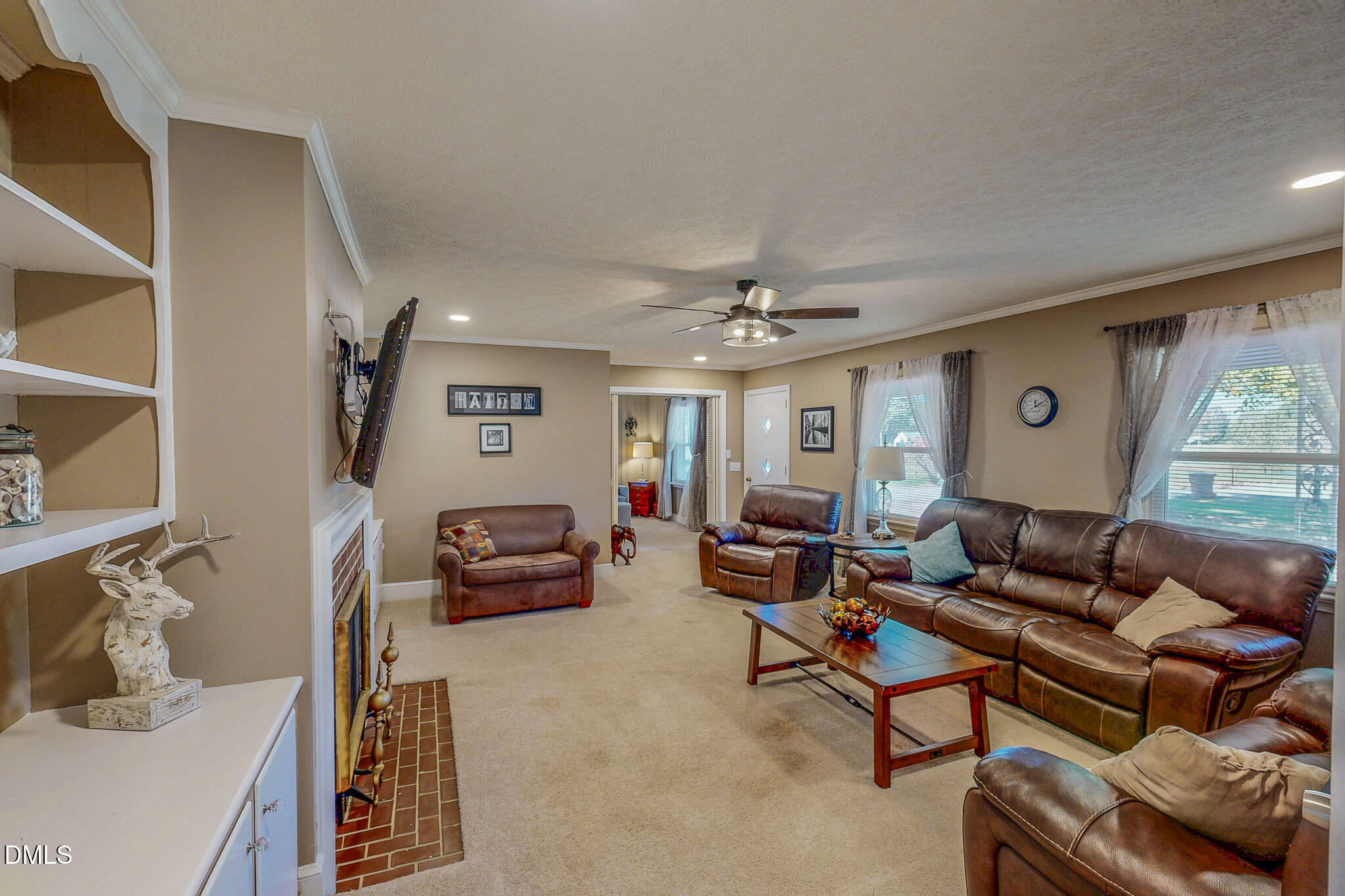 12057 Hurdle Mills Road Hurdle Mills, NC 27541 - Photo 43 of 52 a living room with furniture and a large window