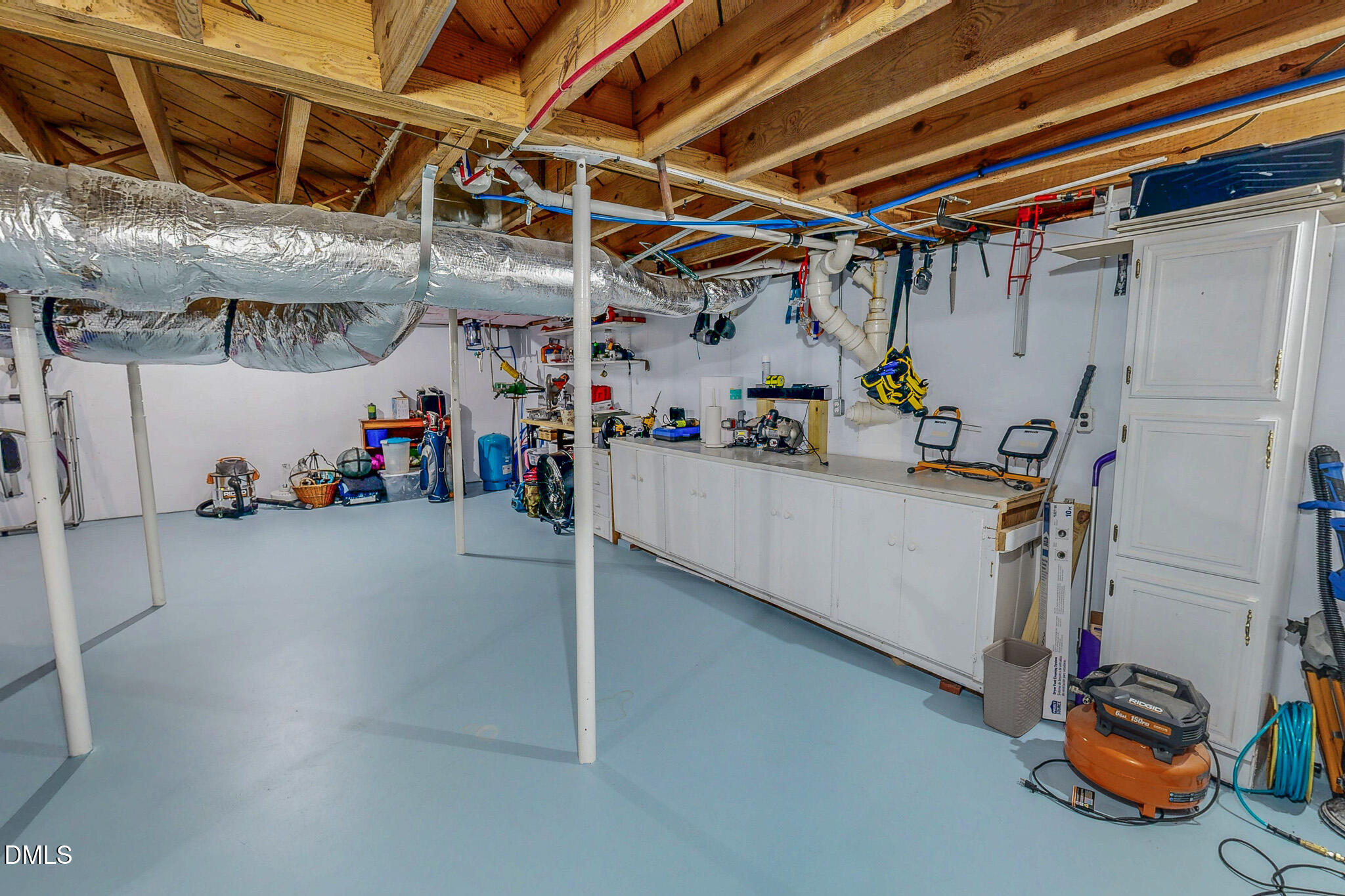 12057 Hurdle Mills Road Hurdle Mills, NC 27541 - Photo 48 of 52 a view of a storage room with gym equipment