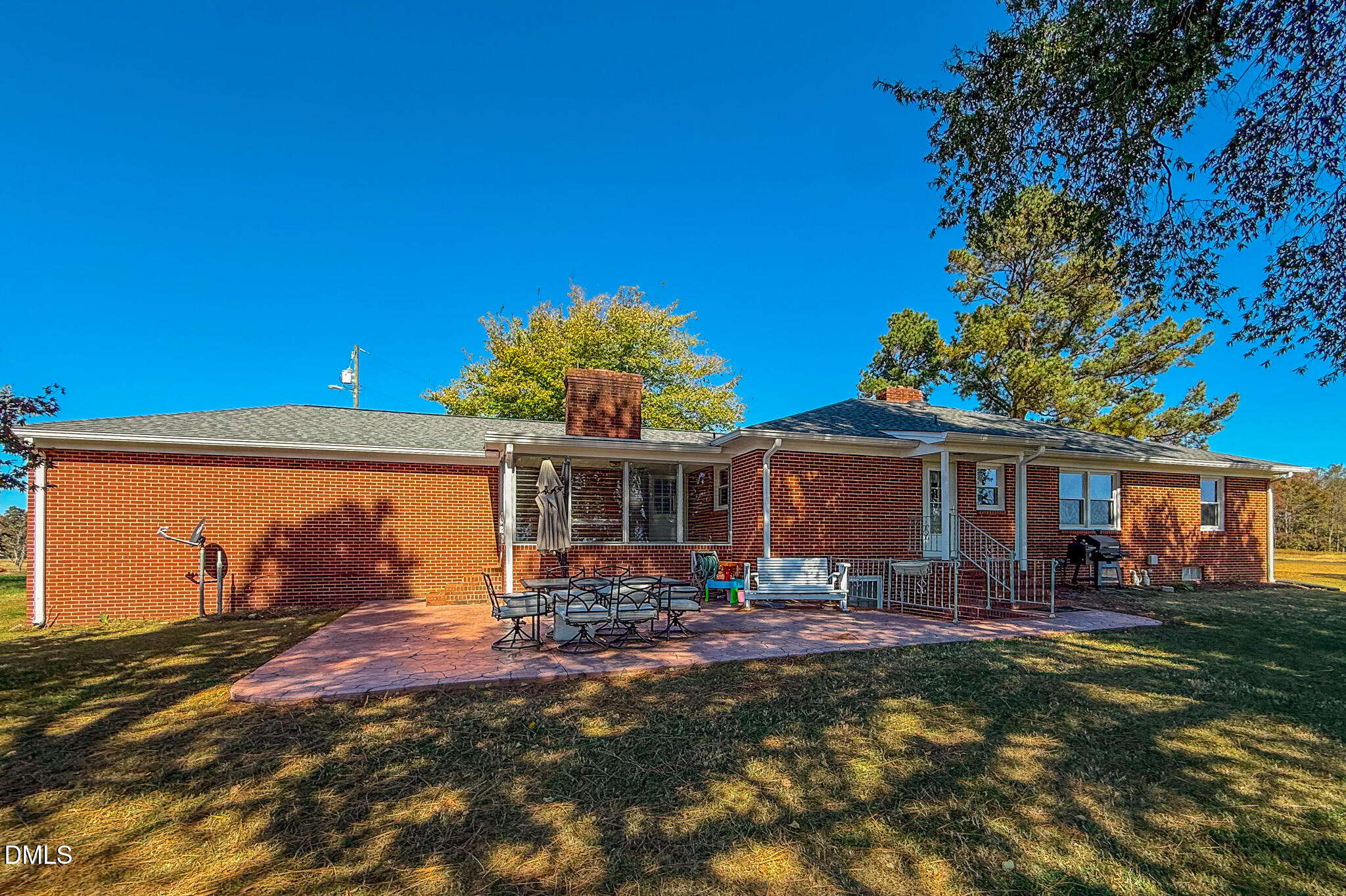 12057 Hurdle Mills Road Hurdle Mills, NC 27541 - Photo 6 of 52 a front view of house with yard and outdoor seating