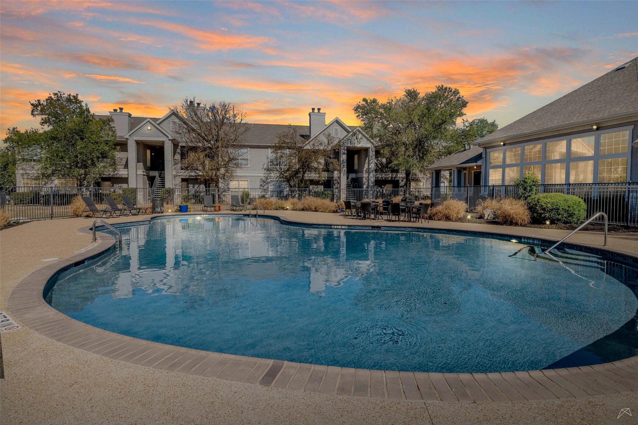 11908 Anderson Mill Road, Unit 321 Cedar Park, TX 78613 - Photo 9 of 24 a view of a swimming pool with a patio