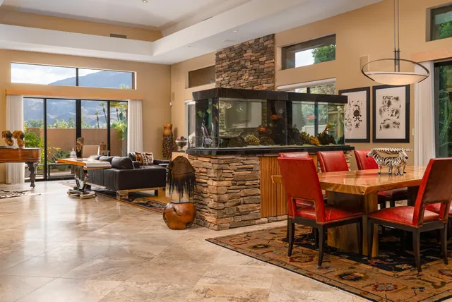 a living room with furniture a window and a fireplace