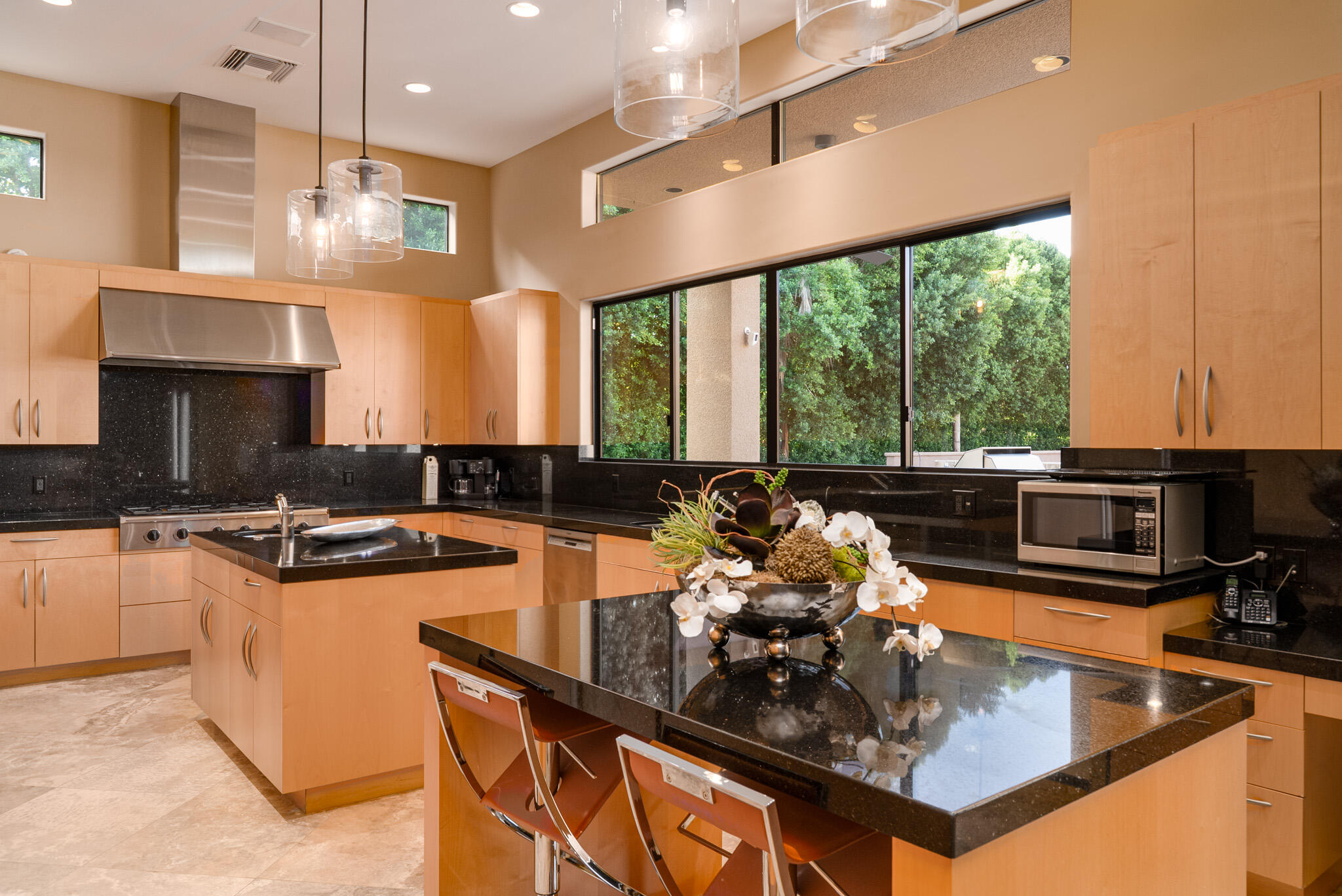72116 Clancy Lane Rancho Mirage, CA 92270 - Photo 21 of 59 a kitchen with a stove a sink and a refrigerator