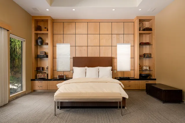 a bedroom with furniture and a bed