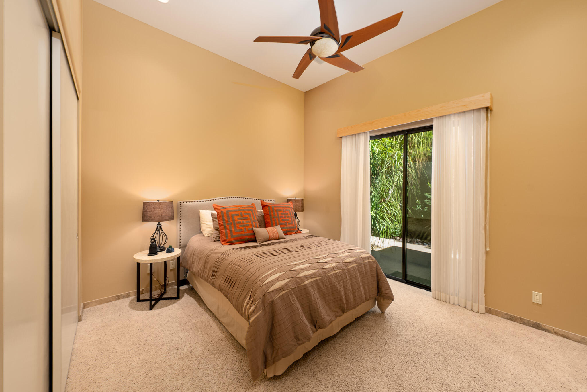 72116 Clancy Lane Rancho Mirage, CA 92270 - Photo 29 of 59 a bedroom with a bed and large window