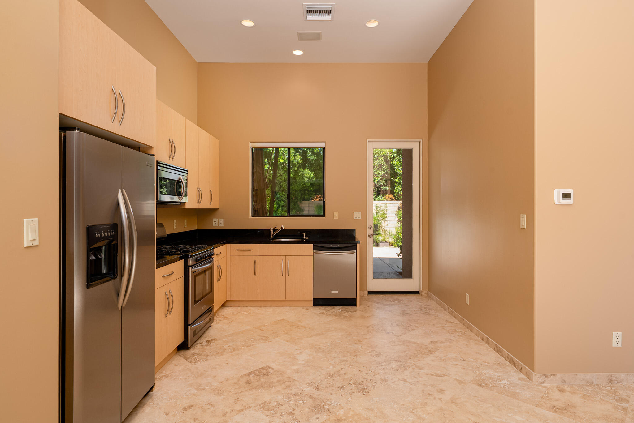 72116 Clancy Lane Rancho Mirage, CA 92270 - Photo 35 of 59 a kitchen with stainless steel appliances granite countertop a refrigerator a sink a stove and a refrigerator