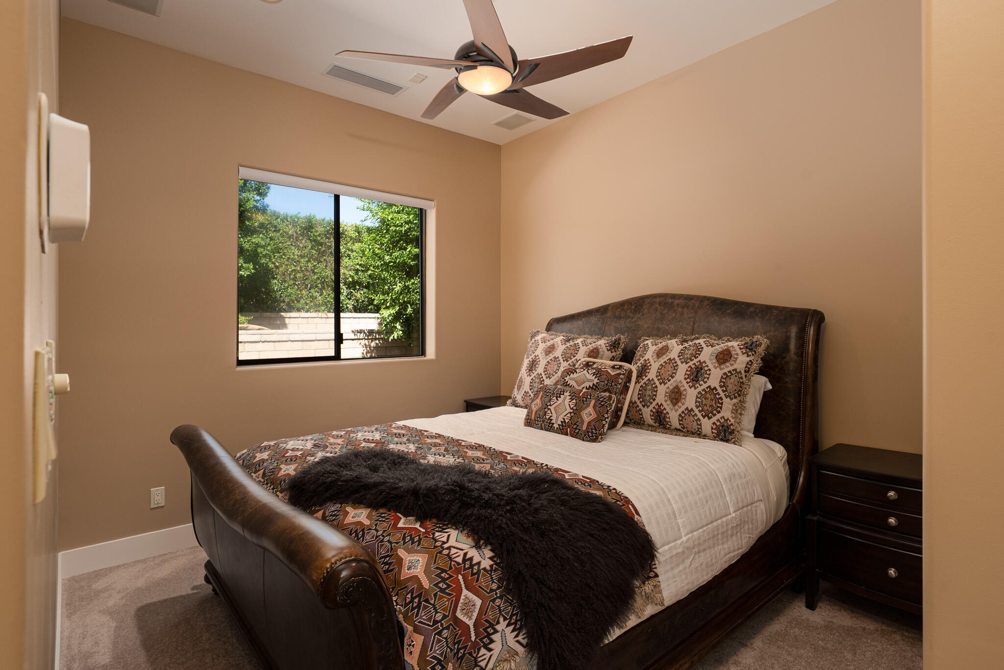 72116 Clancy Lane Rancho Mirage, CA 92270 - Photo 36 of 59 a bedroom with a bed and a window