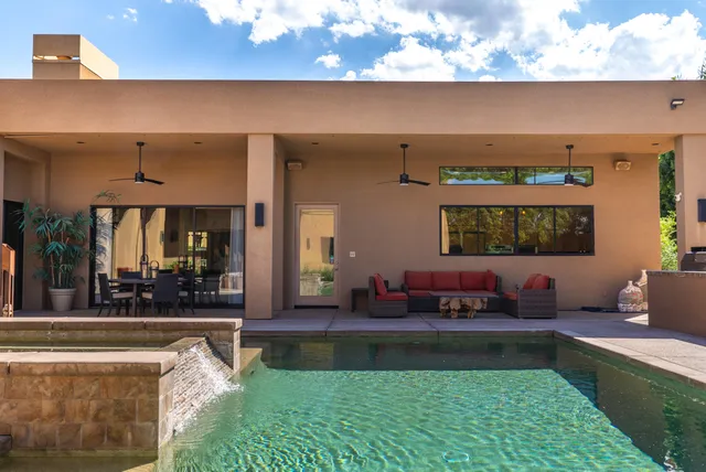 a view of a backyard with sitting area