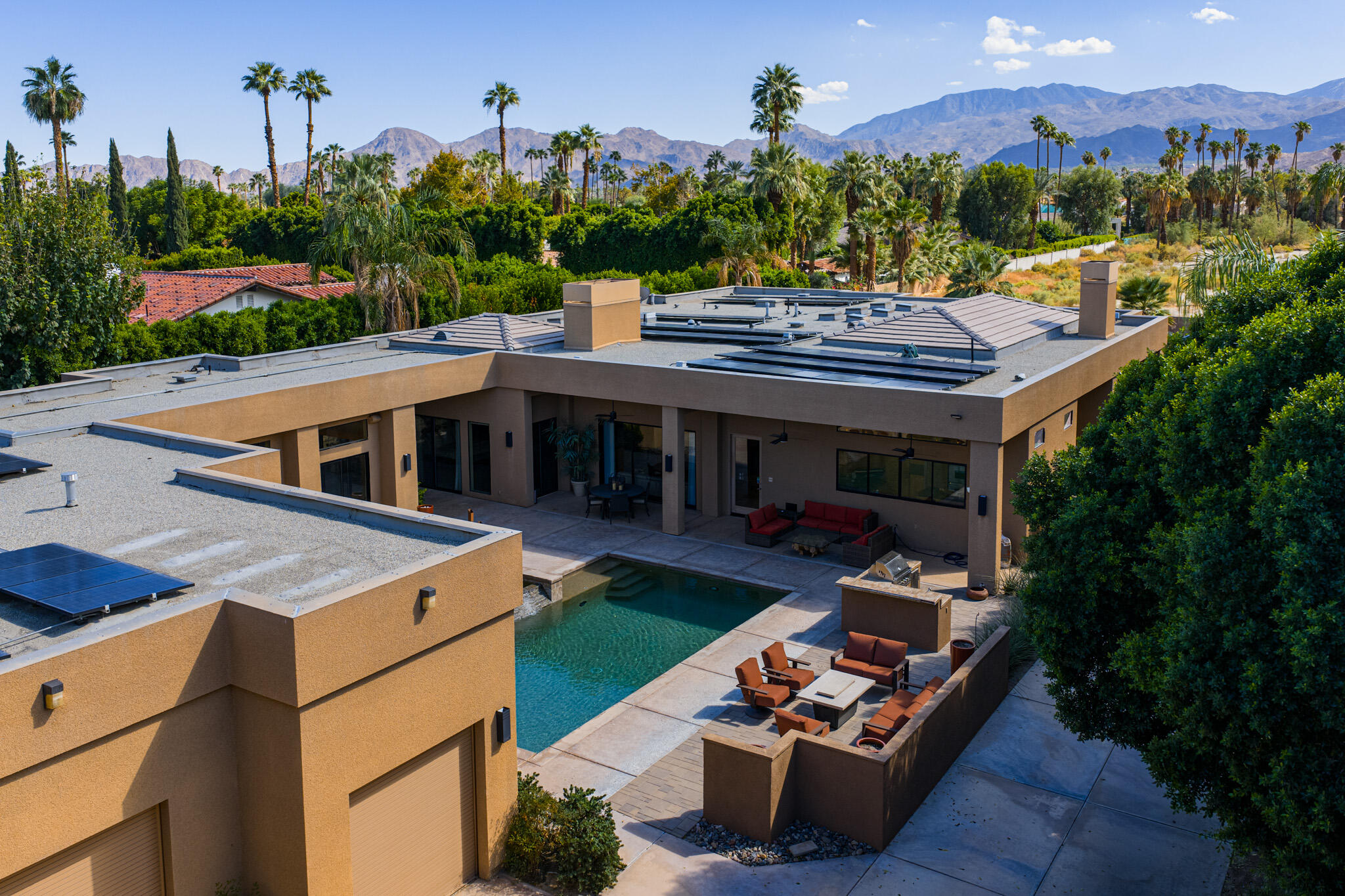 72116 Clancy Lane Rancho Mirage, CA 92270 - Photo 53 of 59 a view of a patio with table and chairs and a fire pit