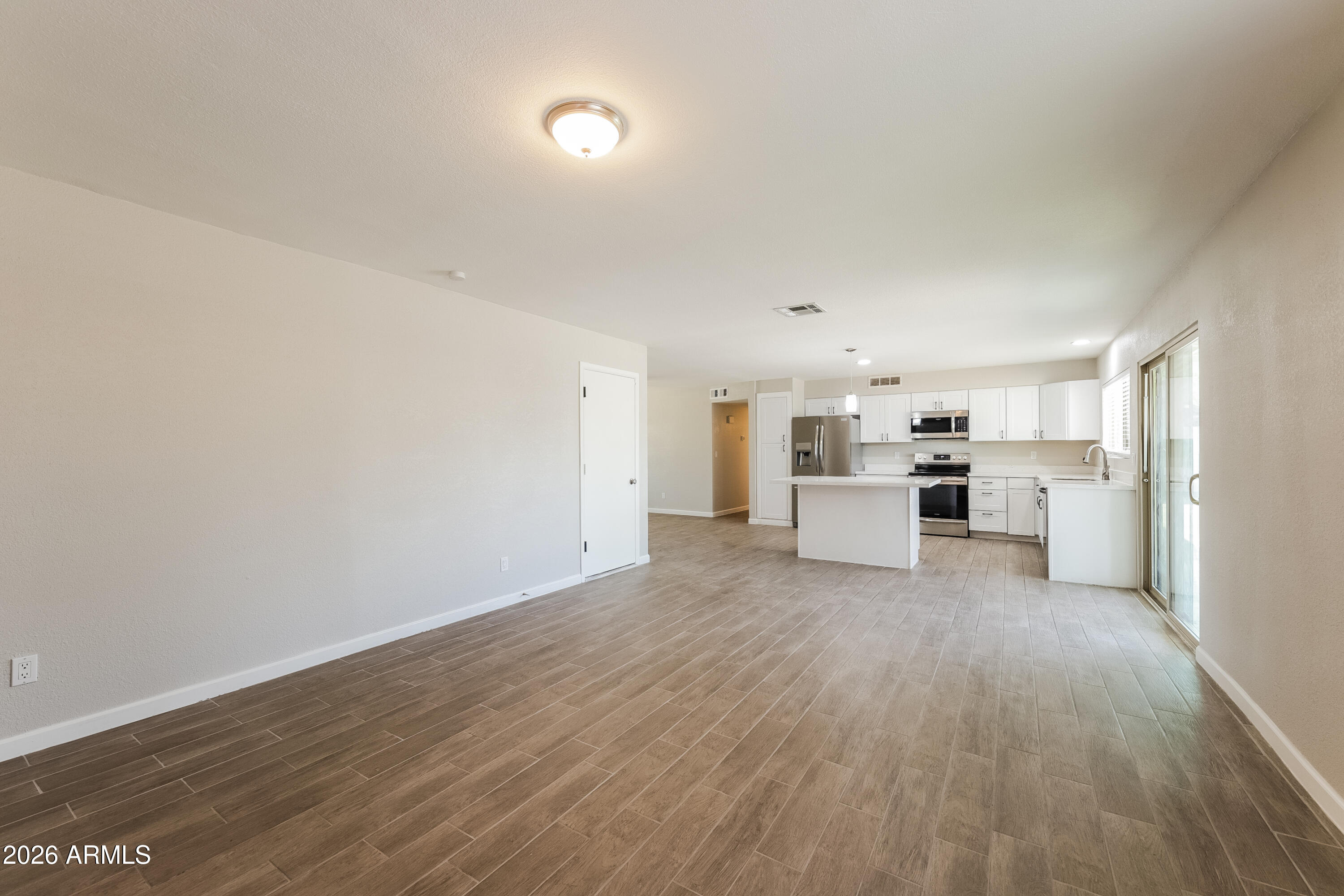 2501 East Villa Rita Drive Phoenix, AZ 85032 - Photo 8 of 15 a view of a kitchen with wooden floor