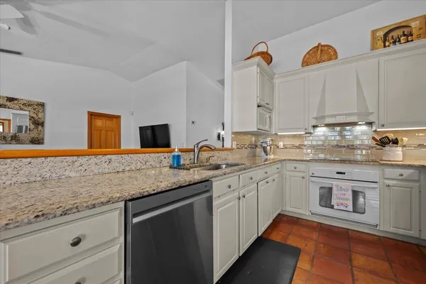 a view of a dining room with furniture large window and wooden floor