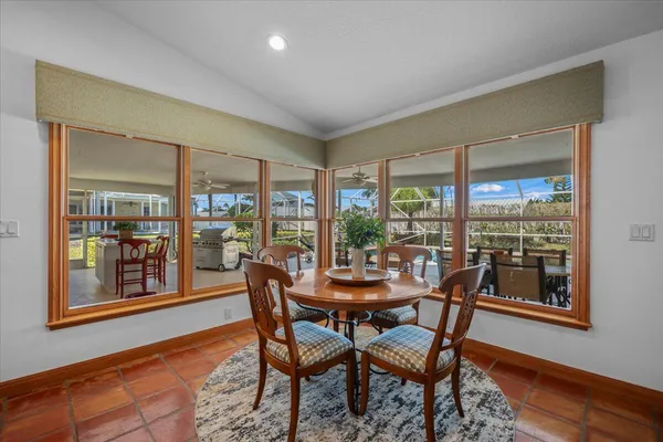 a work room with furniture and a rug