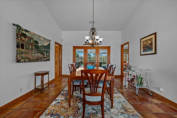 a living room with lots of furniture and wooden floor