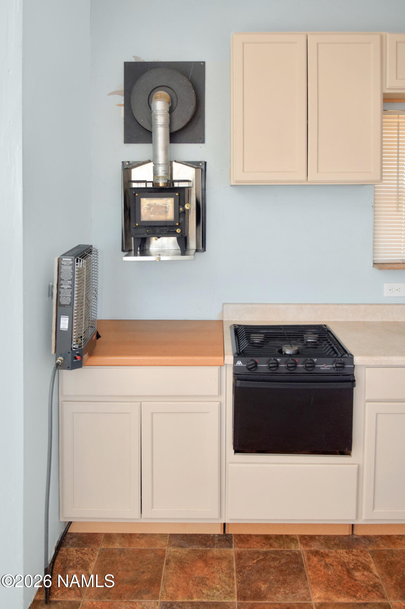 12417 East Tanner Rnch Road Flagstaff, AZ 86005 - Photo 9 of 21 a kitchen with a stove and a microwave