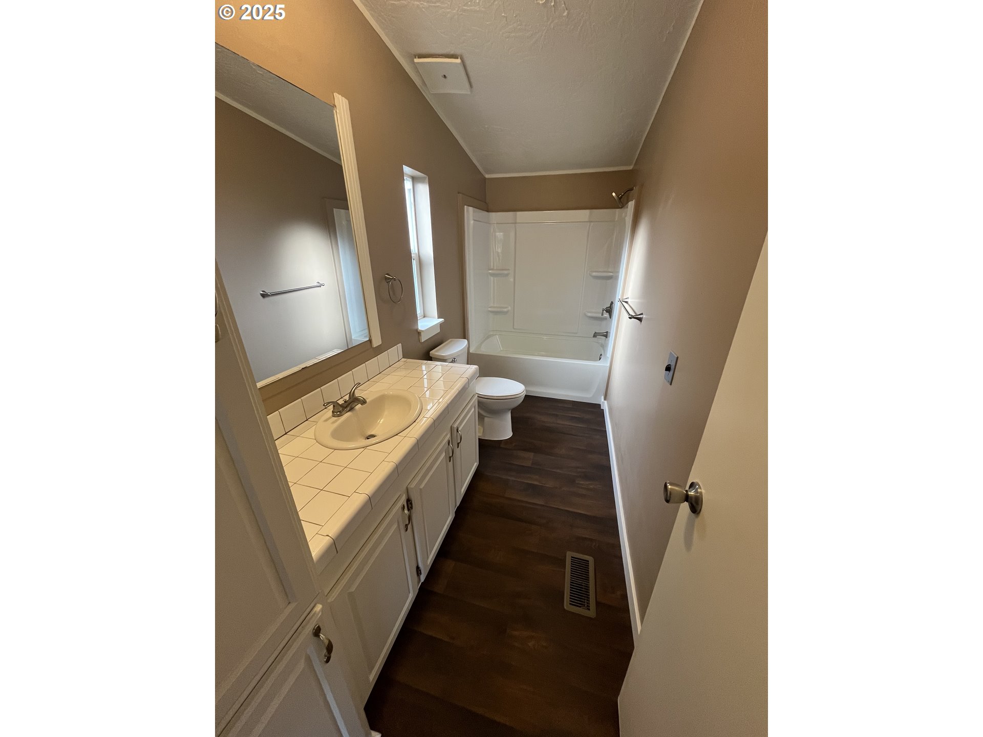 7032 Main Street Springfield, OR 97478 - Photo 14 of 17 a view of a hallway with two windows