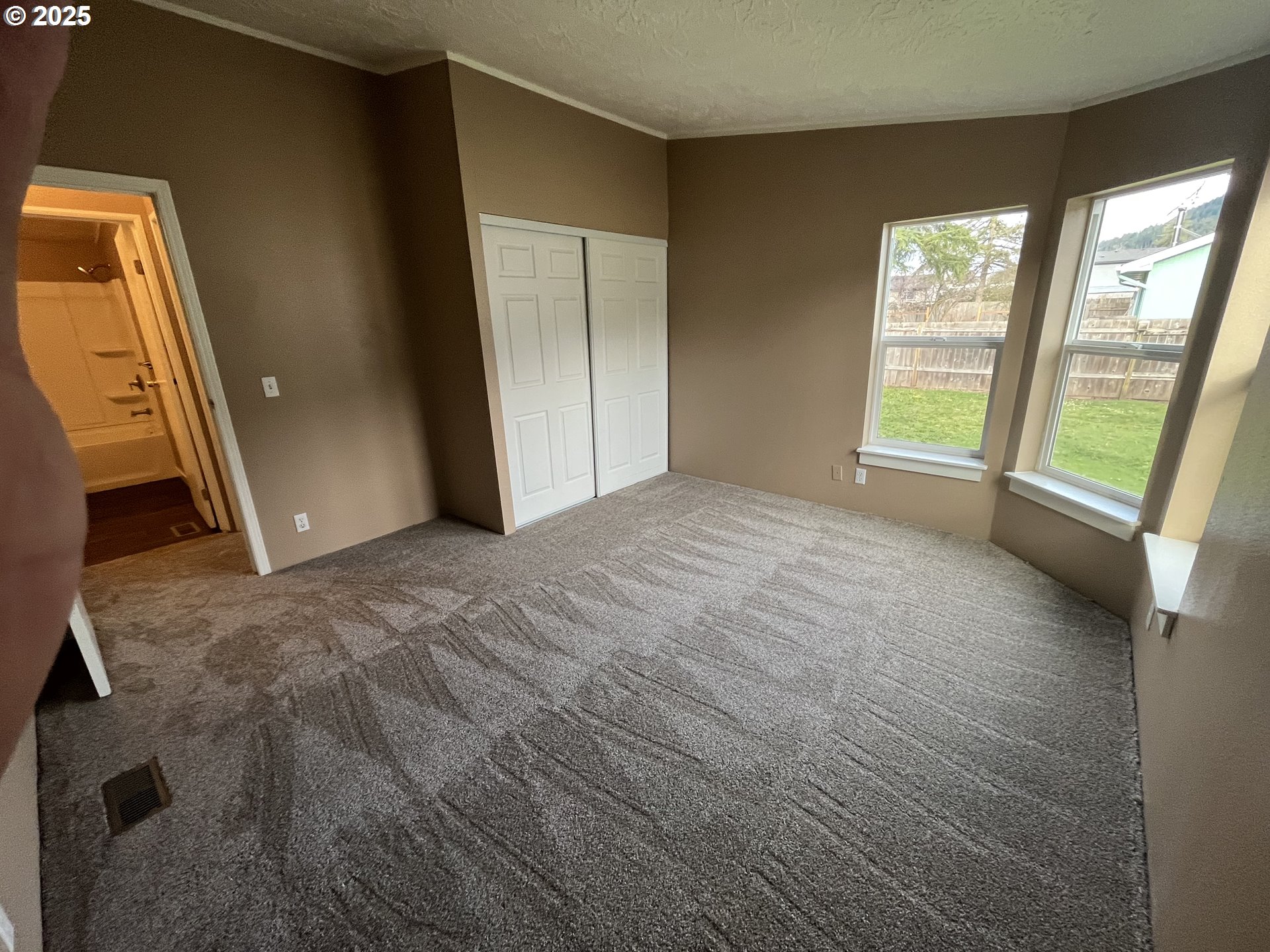 7032 Main Street Springfield, OR 97478 - Photo 16 of 17 a view of an empty room with a fireplace
