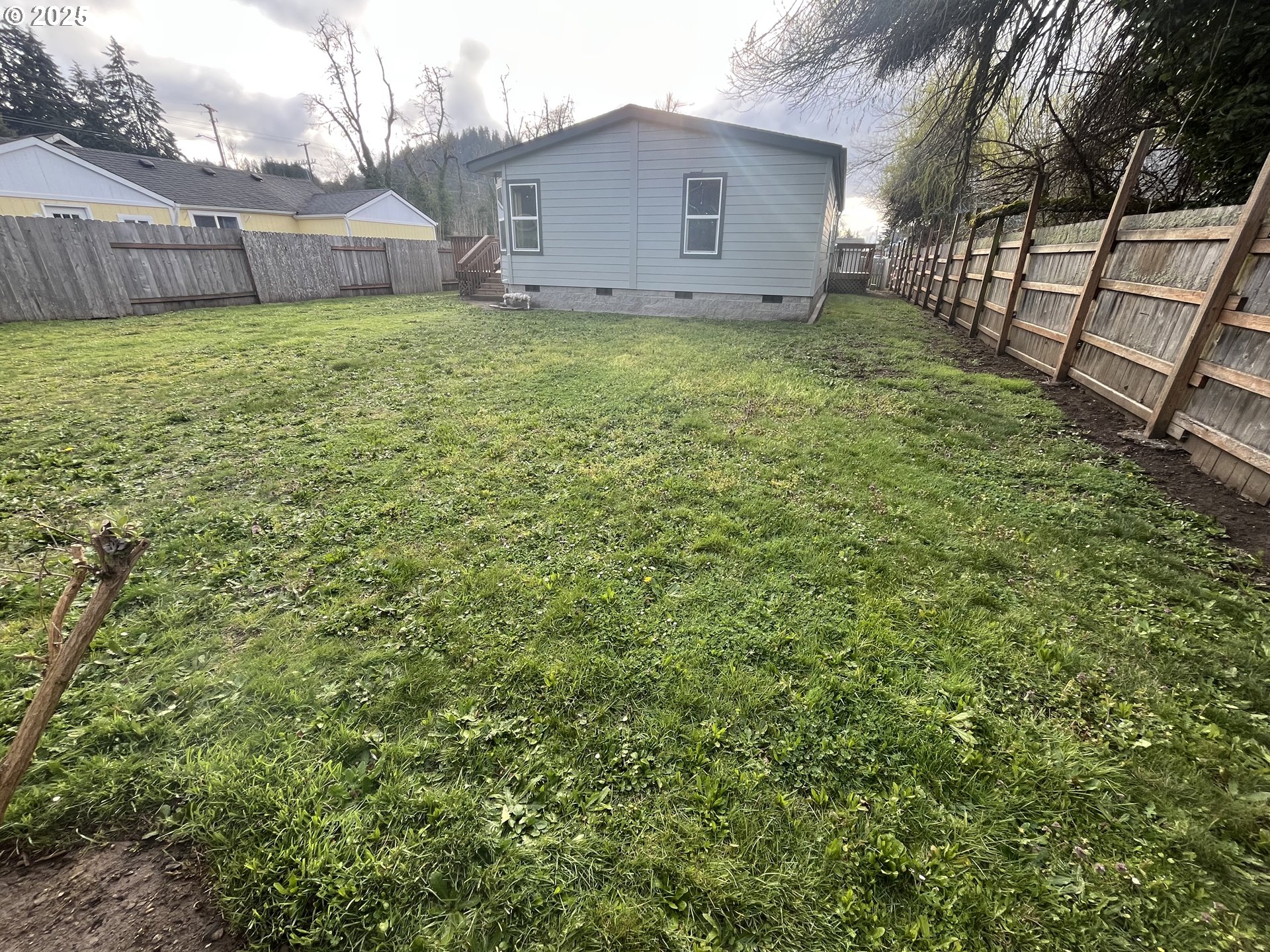 7032 Main Street Springfield, OR 97478 - Photo 2 of 17 a view of a house with a backyard