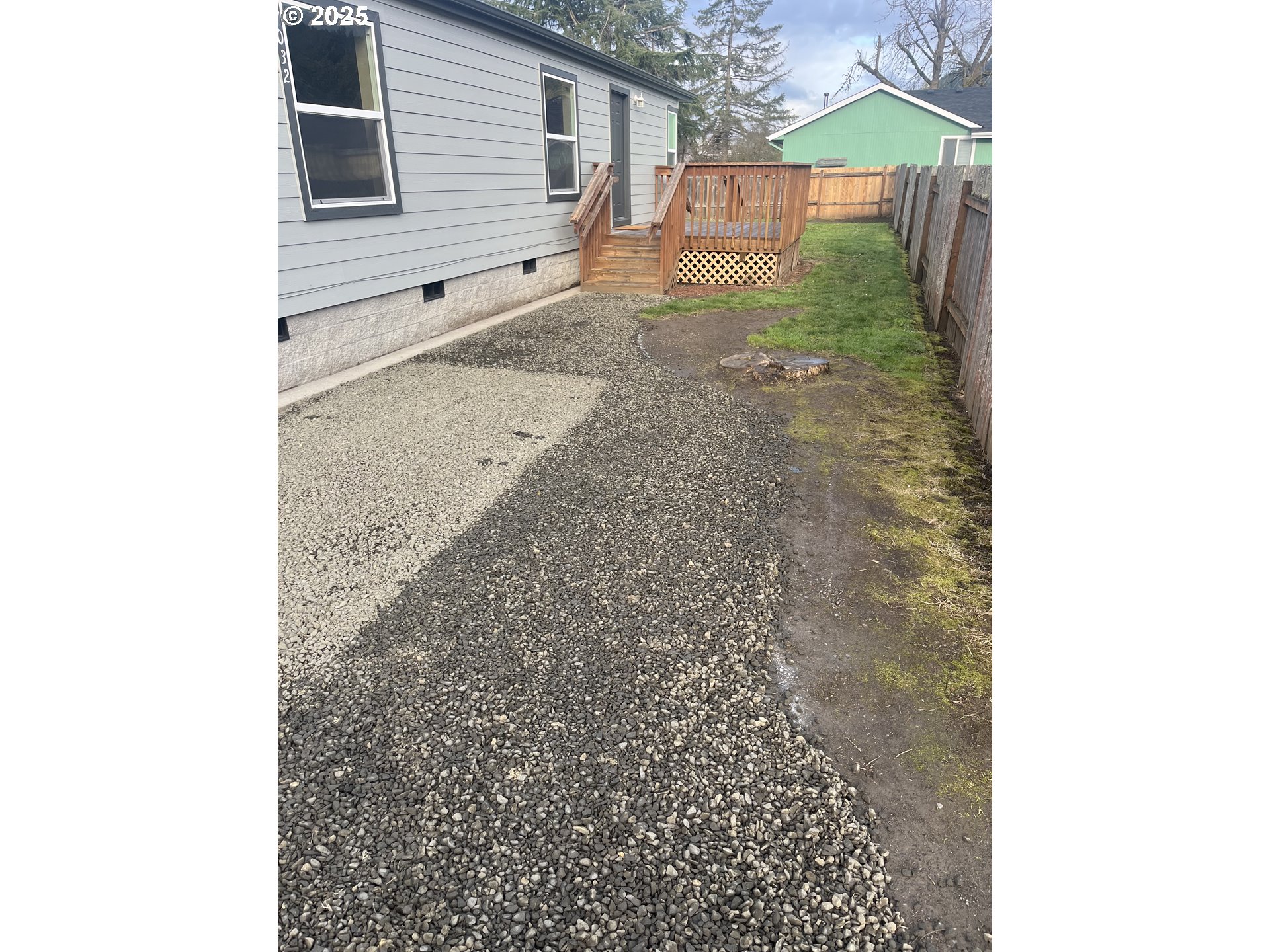 7032 Main Street Springfield, OR 97478 - Photo 3 of 17 a view of a backyard of the house