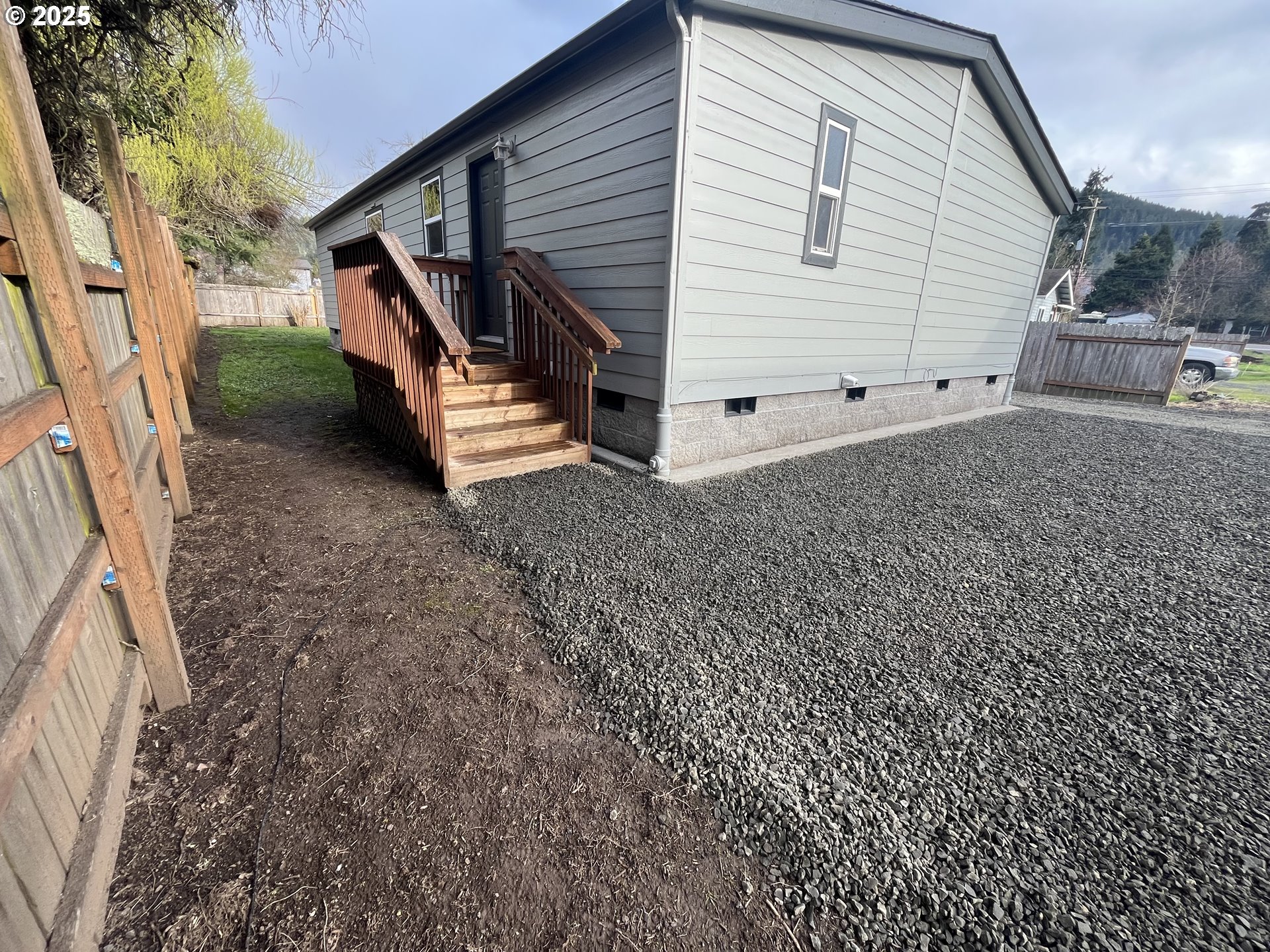 7032 Main Street Springfield, OR 97478 - Photo 4 of 17 a view of house with backyard and deck