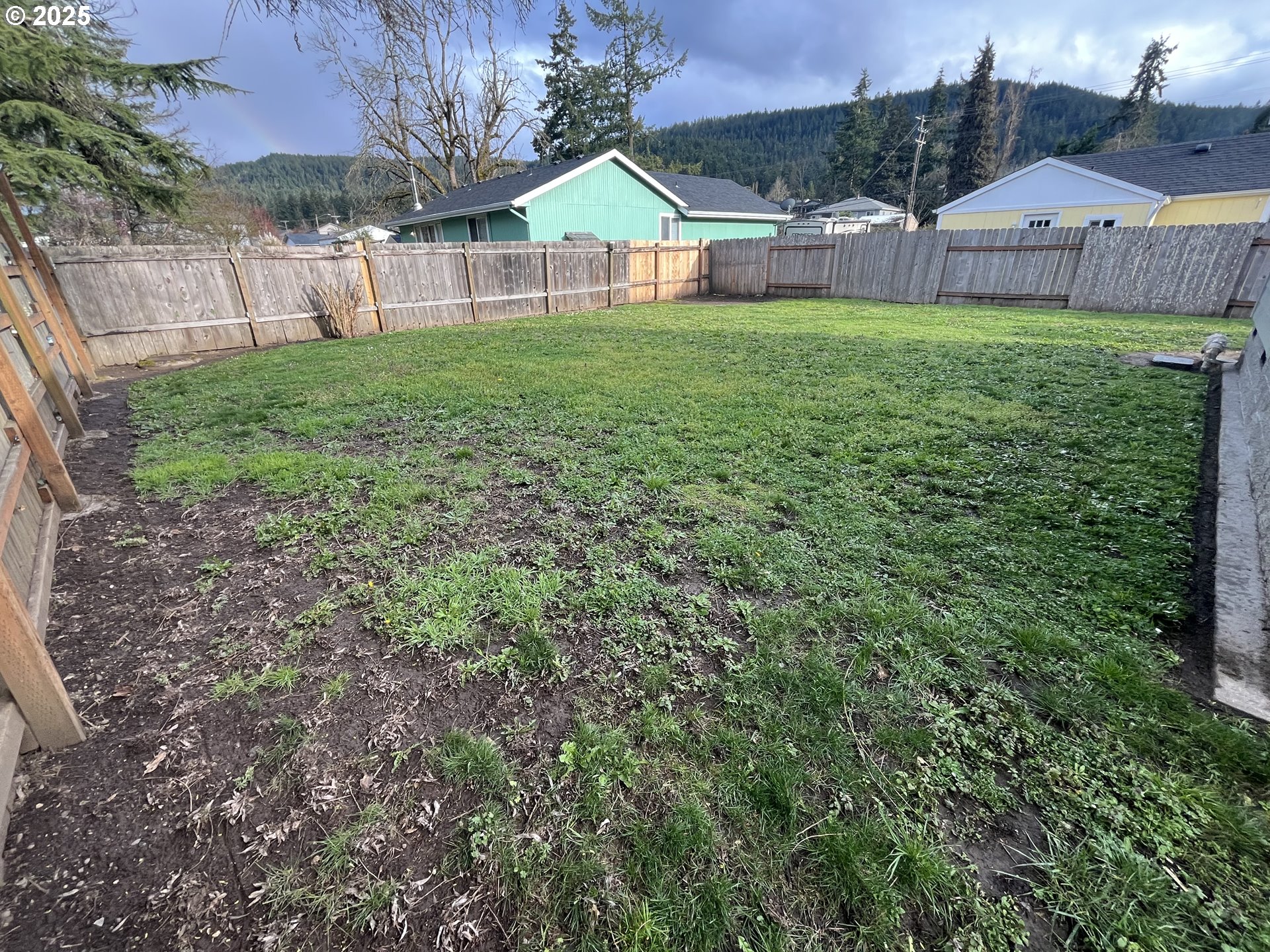 7032 Main Street Springfield, OR 97478 - Photo 5 of 17 a view of house with backyard and garden