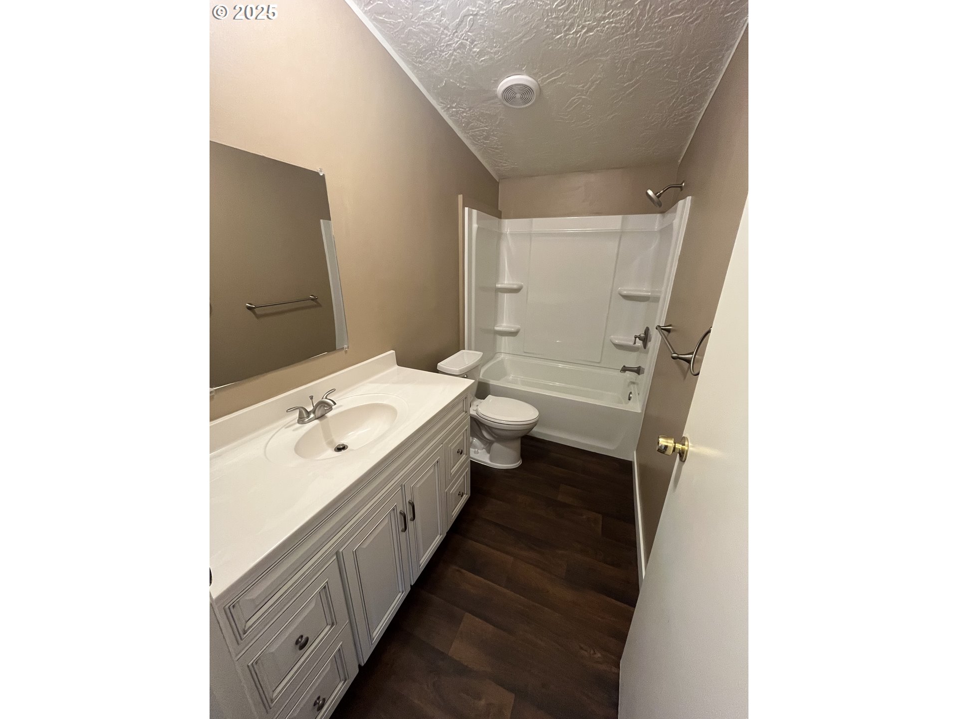7032 Main Street Springfield, OR 97478 - Photo 8 of 17 a bathroom with a double vanity sink toilet and mirror