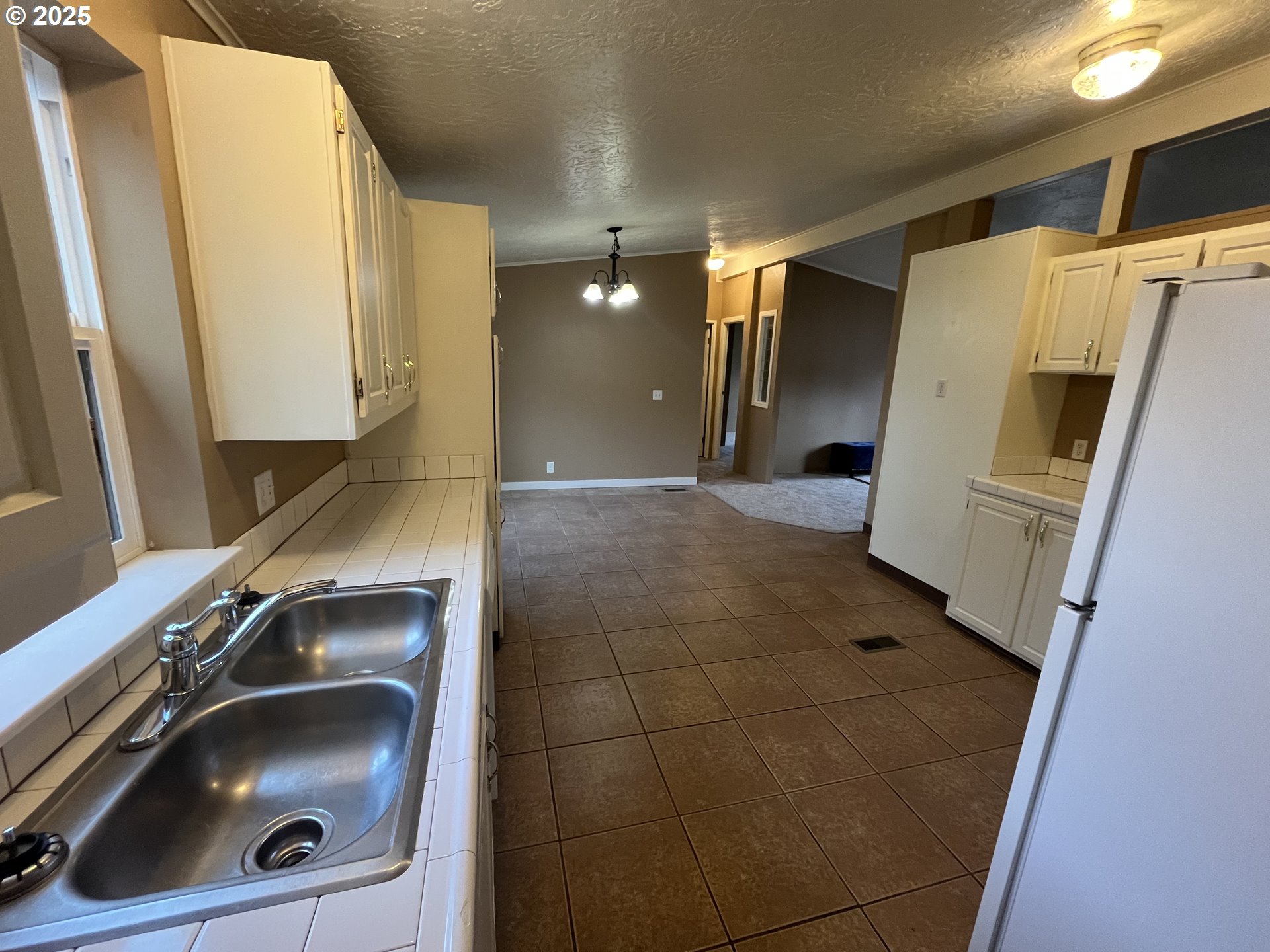 7032 Main Street Springfield, OR 97478 - Photo 10 of 17 a bathroom with a sink and mirror