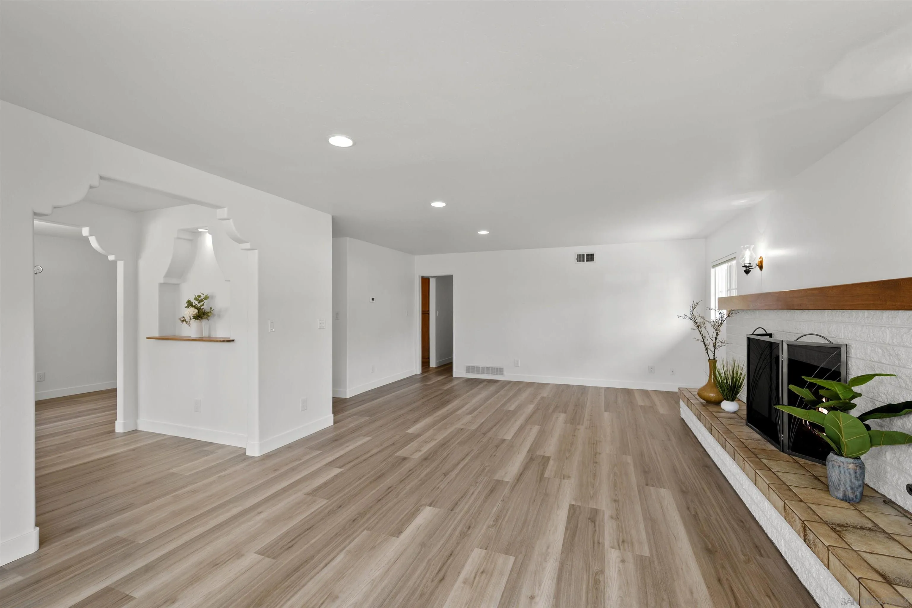 1835 Westward Ho Circle El Cajon, CA 92021 - Photo 11 of 57 a view of empty room with wooden floor and fireplace