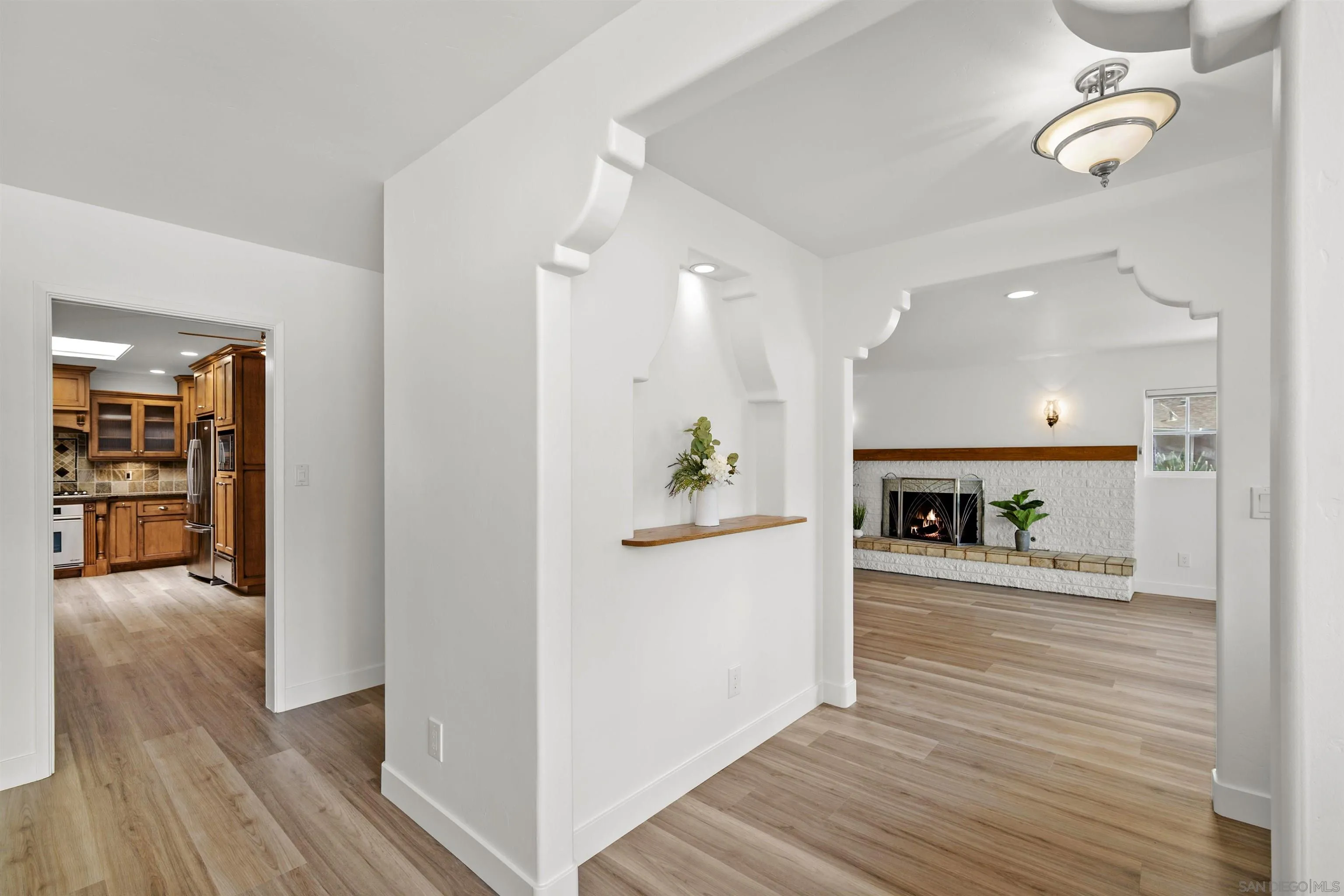 1835 Westward Ho Circle El Cajon, CA 92021 - Photo 12 of 57 a view of a hallway with wooden floor fireplace and dining room