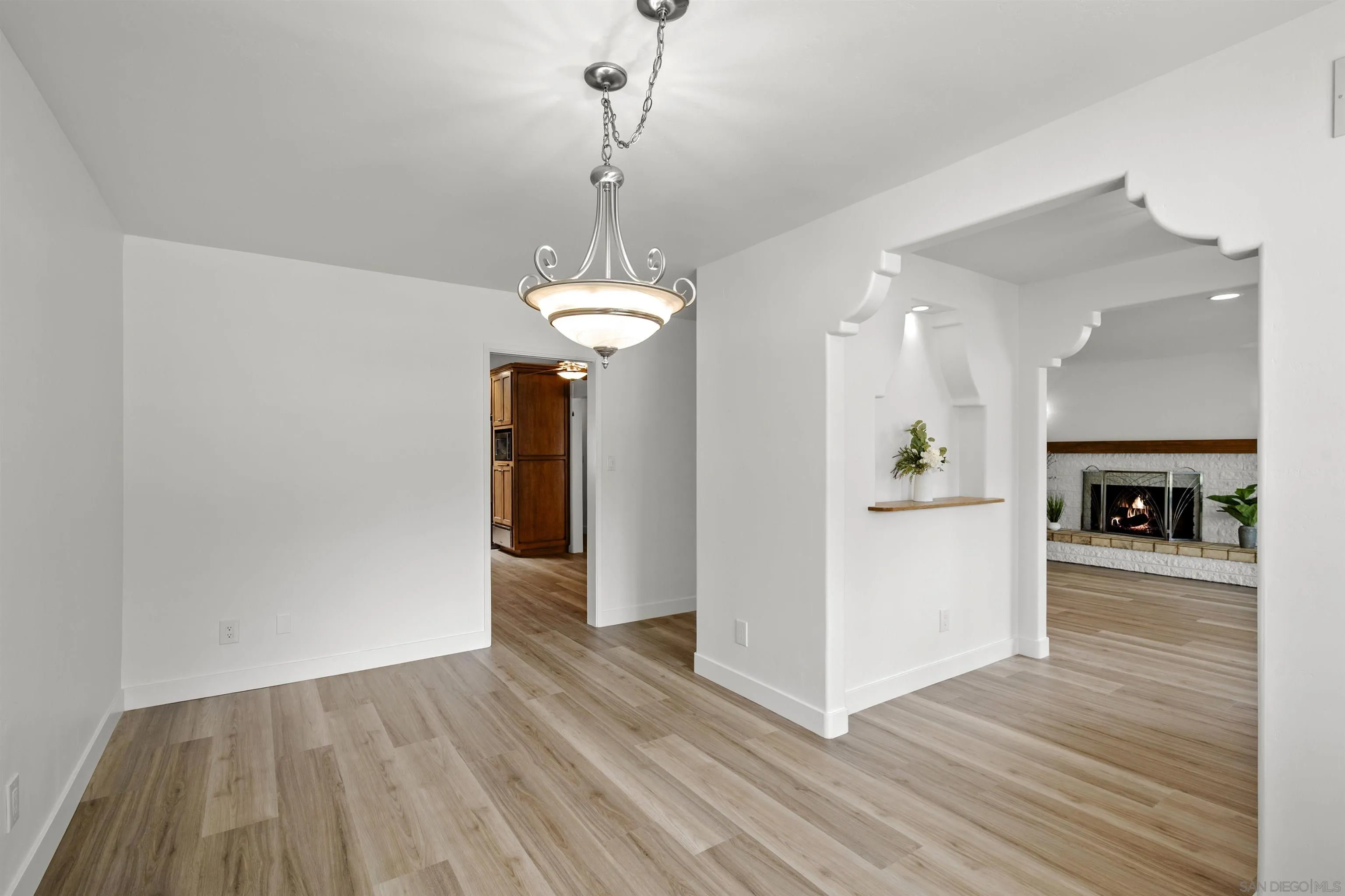 1835 Westward Ho Circle El Cajon, CA 92021 - Photo 14 of 57 a view of a livingroom with wooden floor and a ceiling fan
