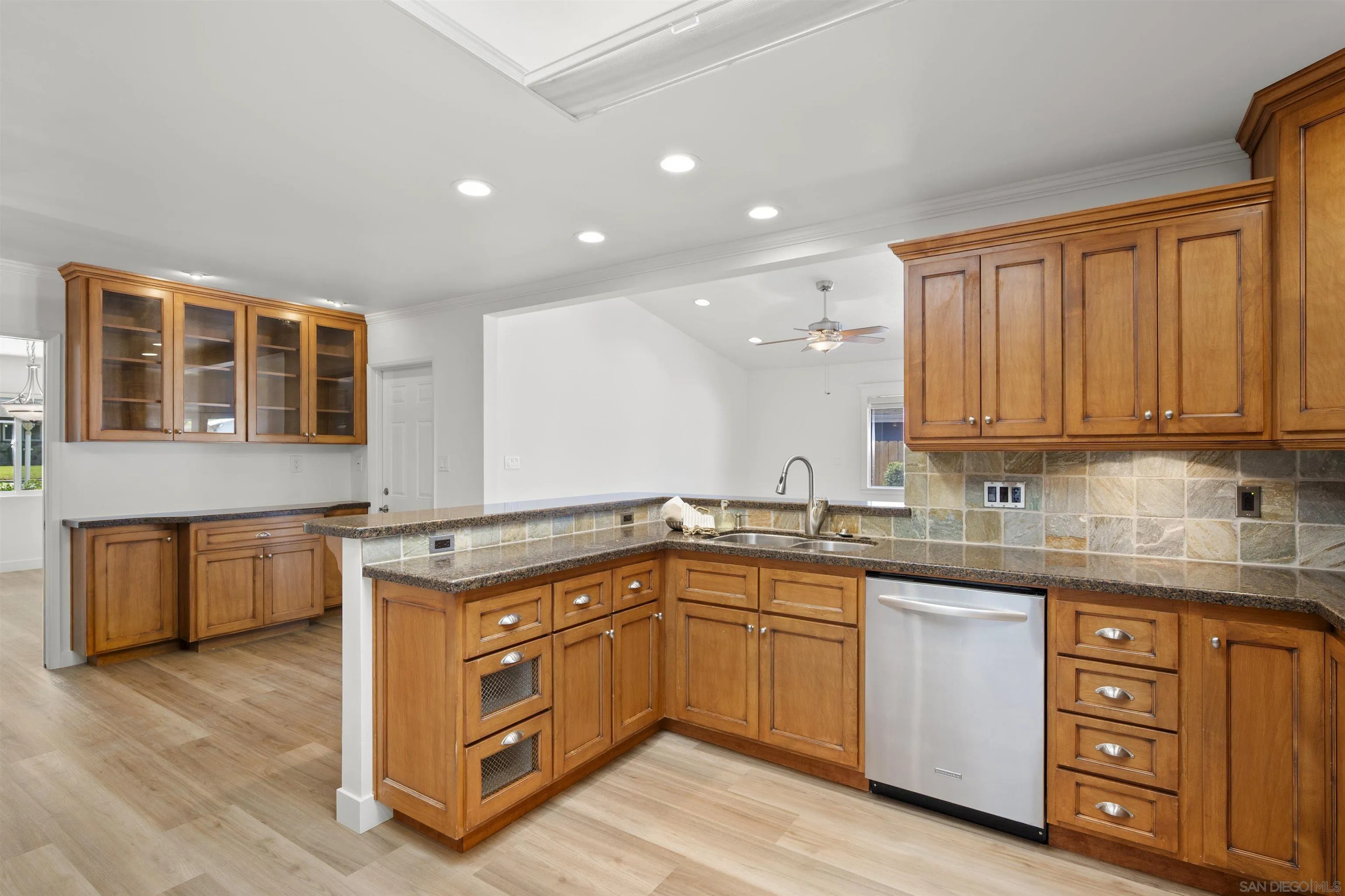 1835 Westward Ho Circle El Cajon, CA 92021 - Photo 20 of 57 a kitchen with a stove sink and cabinets