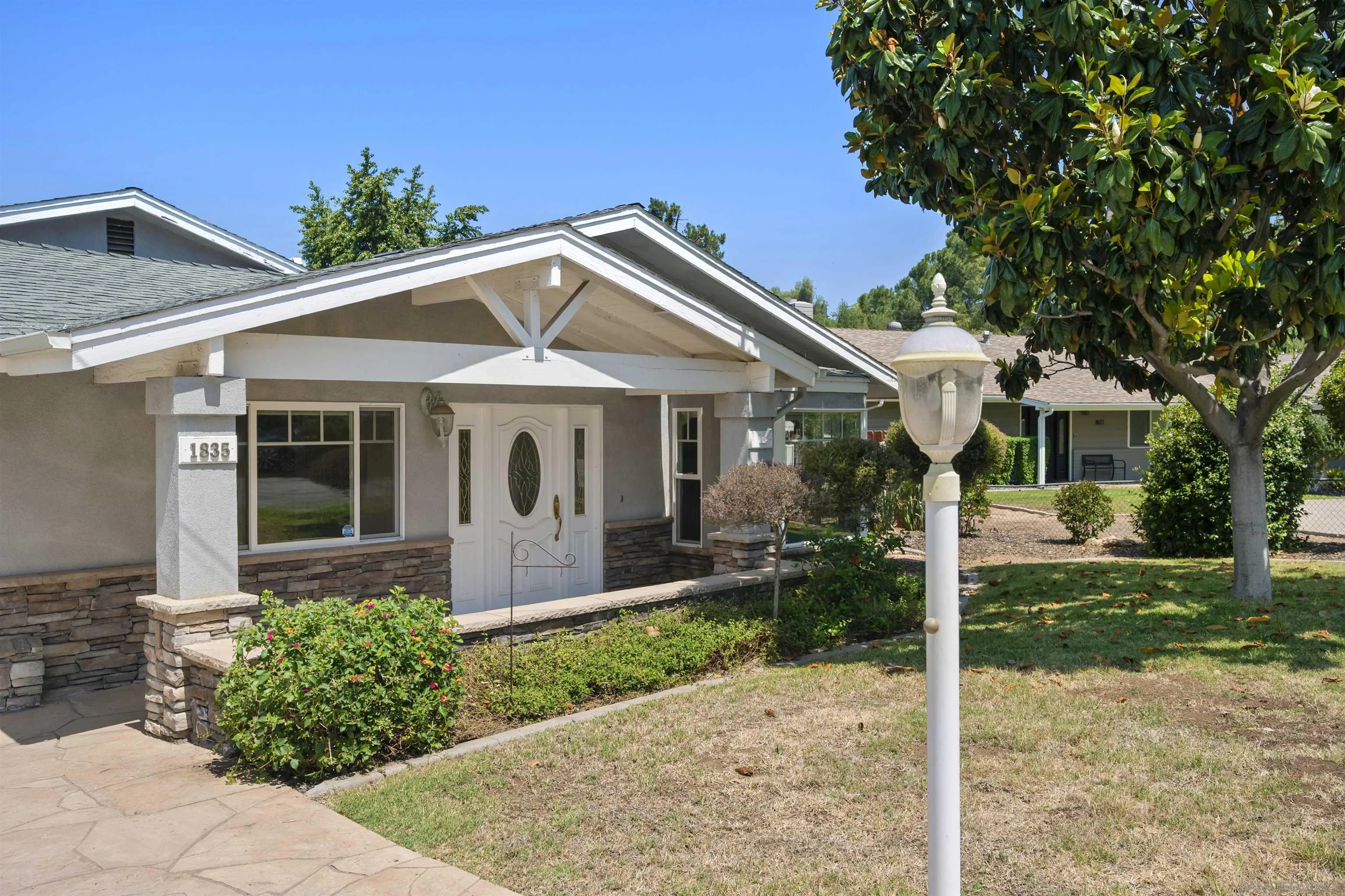 1835 Westward Ho Circle El Cajon, CA 92021 - Photo 2 of 57 a front view of a house with garden