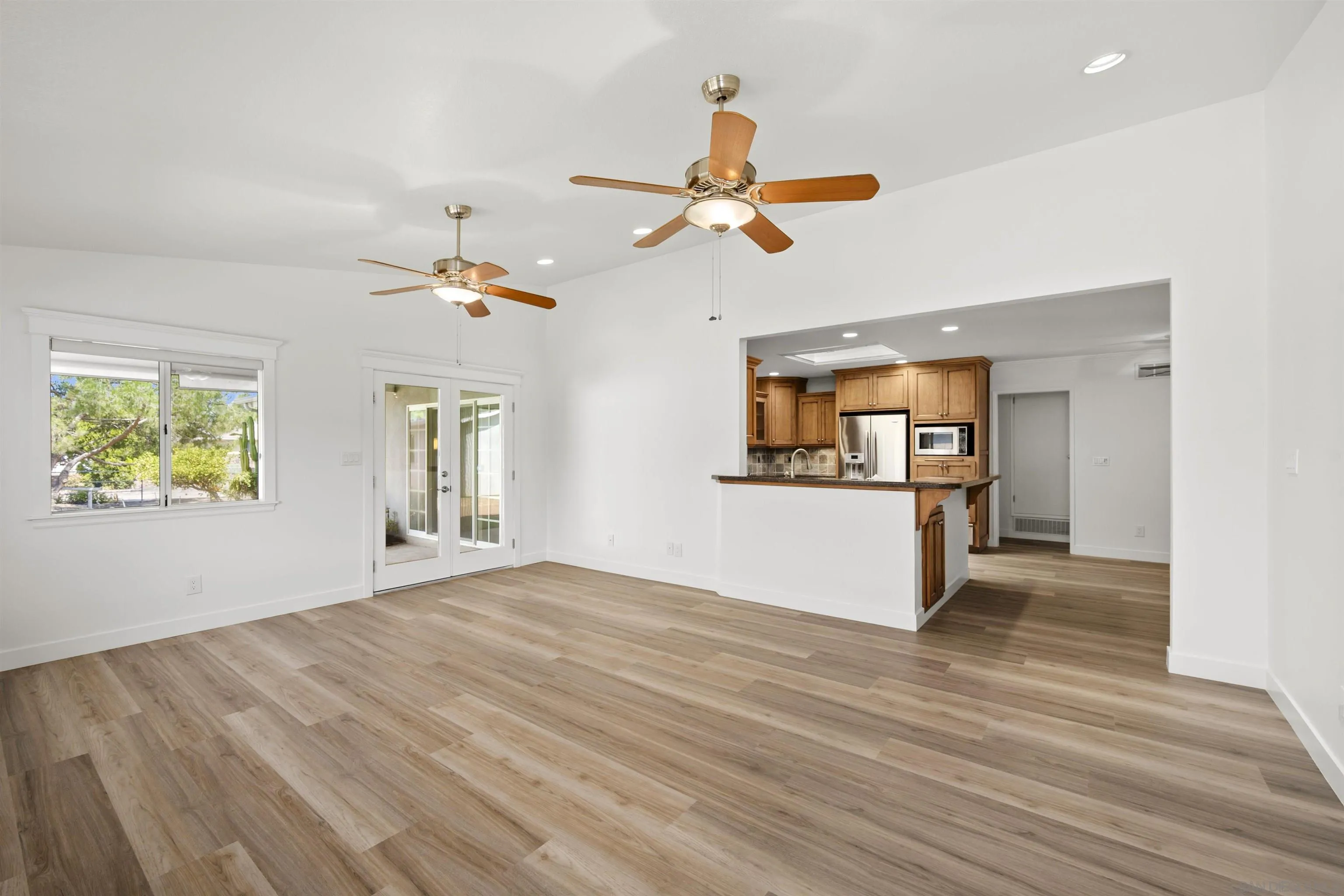 1835 Westward Ho Circle El Cajon, CA 92021 - Photo 24 of 57 a view of an empty room with wooden floor and a window