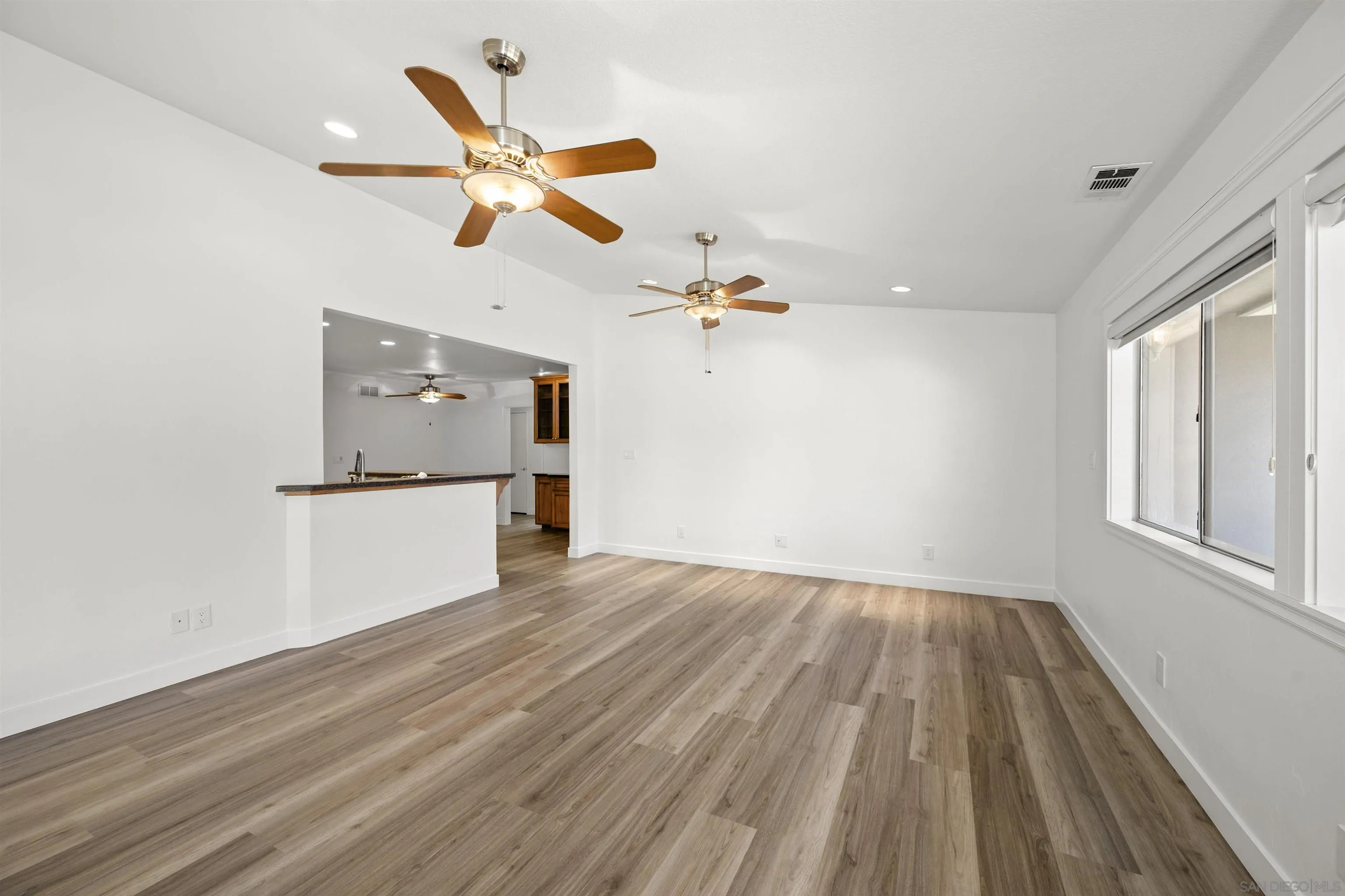 1835 Westward Ho Circle El Cajon, CA 92021 - Photo 25 of 57 wooden floor in an empty room with a window