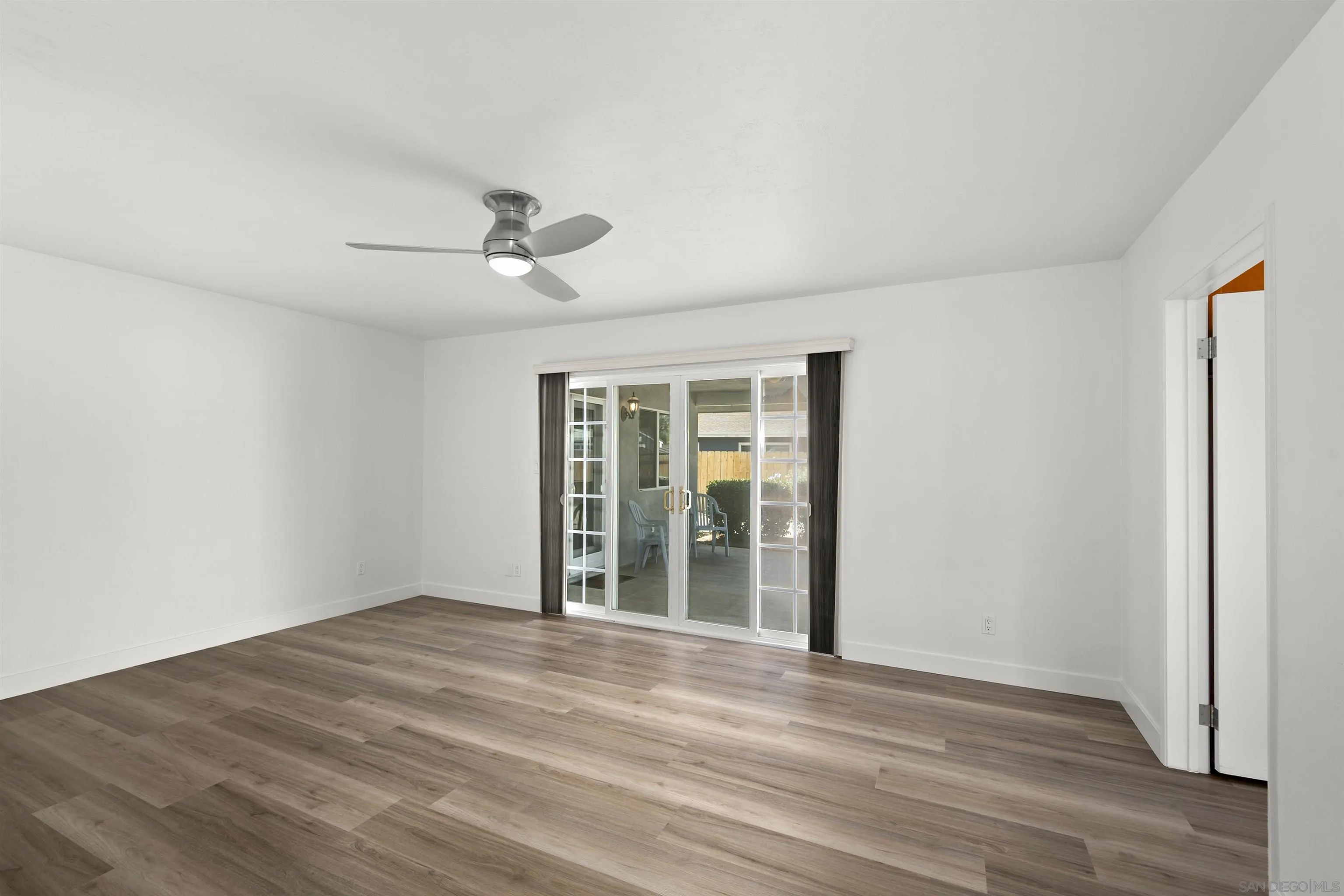 1835 Westward Ho Circle El Cajon, CA 92021 - Photo 27 of 57 a view of a livingroom with wooden floor and a ceiling fan