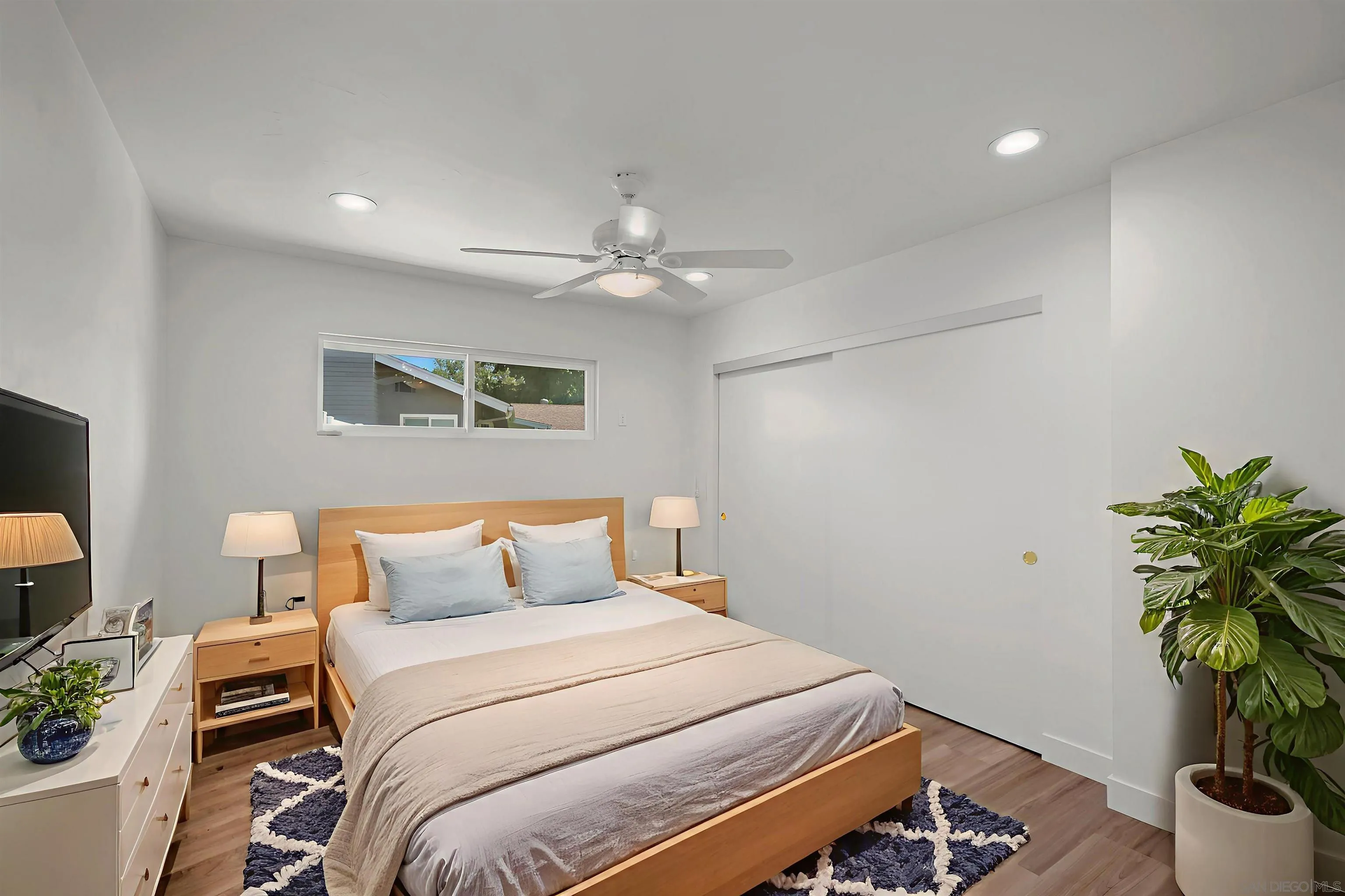 1835 Westward Ho Circle El Cajon, CA 92021 - Photo 30 of 57 a bedroom with a bed and a potted plant