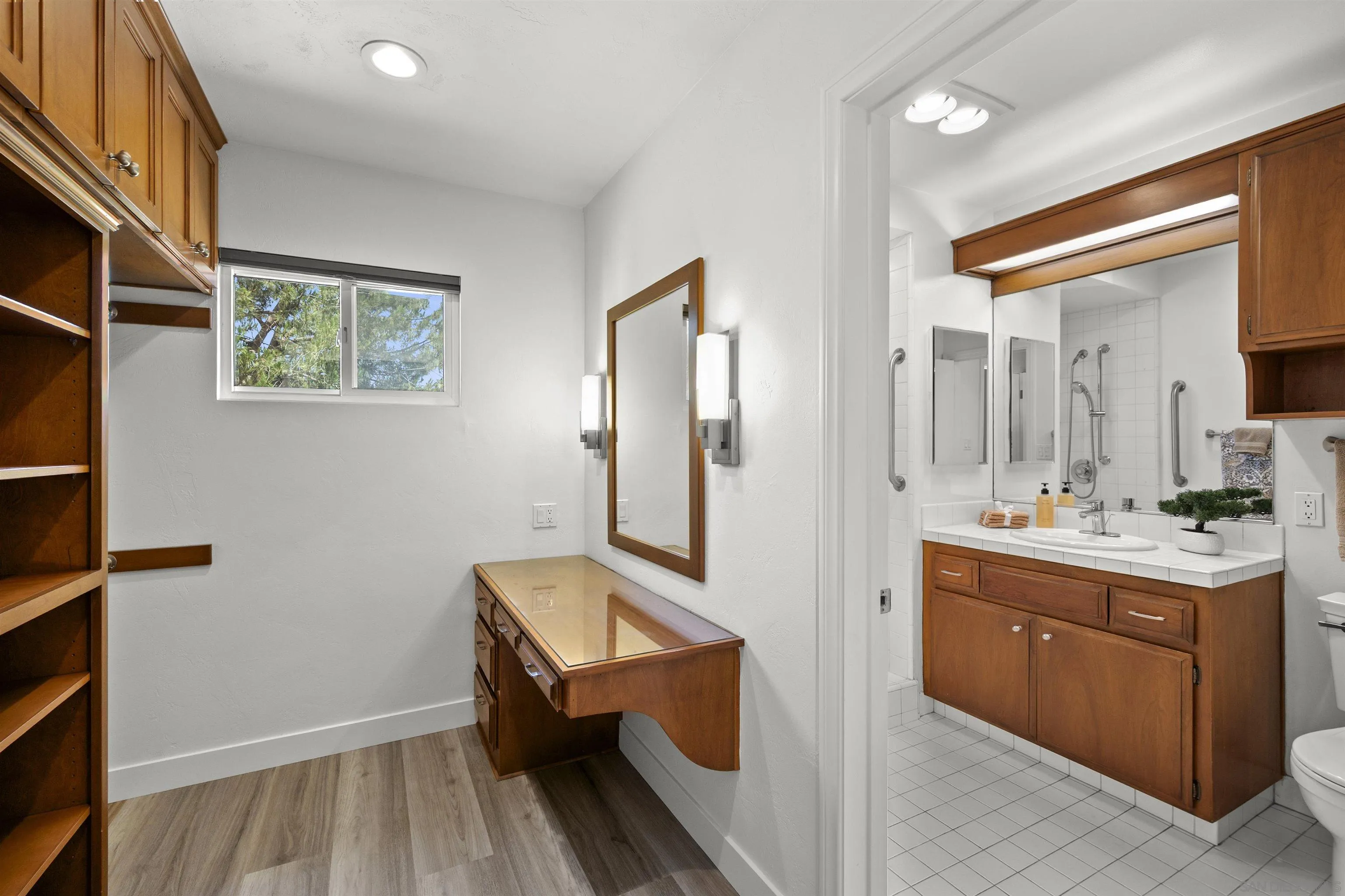 1835 Westward Ho Circle El Cajon, CA 92021 - Photo 36 of 57 a view of hallway with cabinets and wooden floor