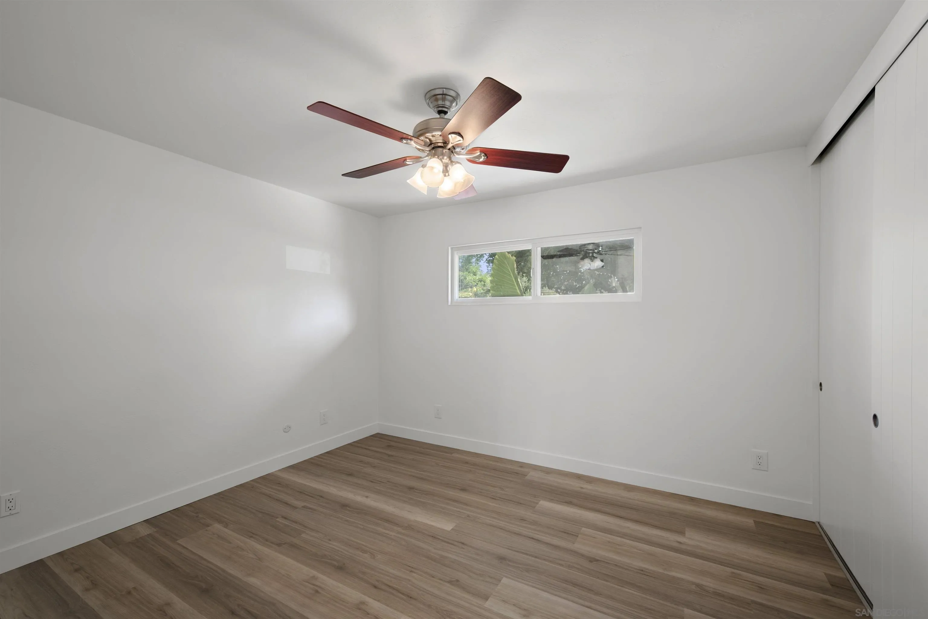 1835 Westward Ho Circle El Cajon, CA 92021 - Photo 39 of 57 an empty room with a window and a ceiling fan