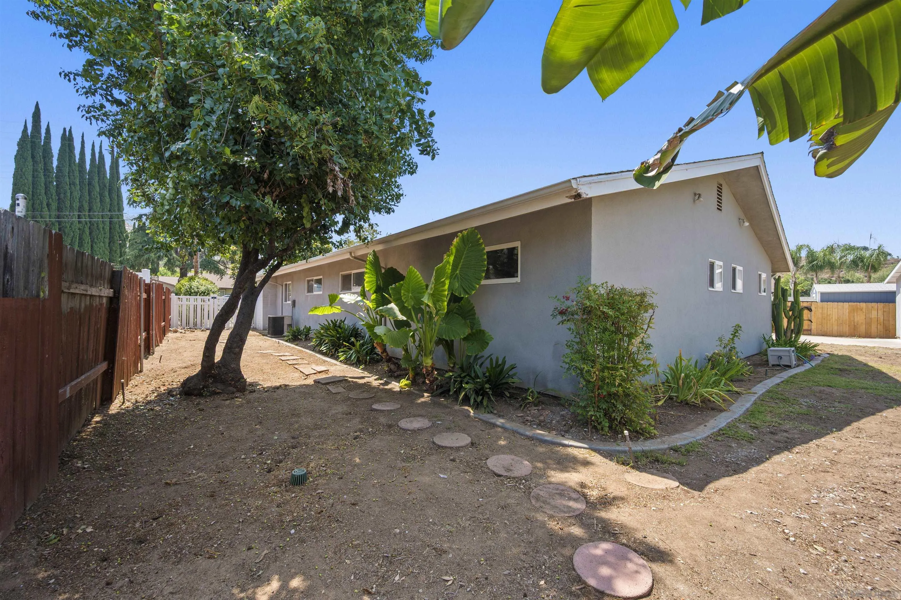 1835 Westward Ho Circle El Cajon, CA 92021 - Photo 48 of 57 a front view of a house with garden