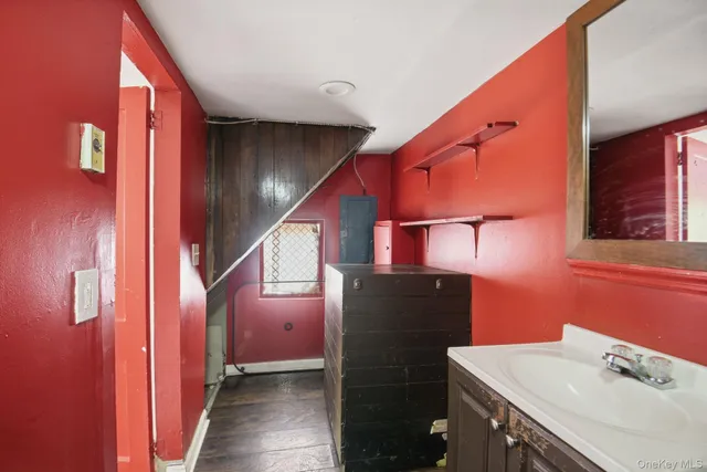 a bathroom with a sink and mirror