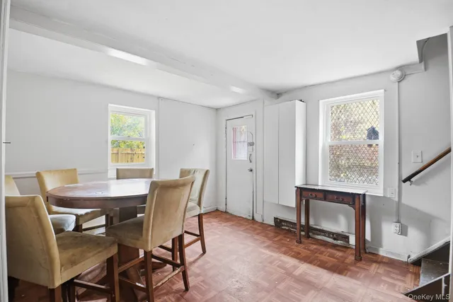 a view of a dining room with furniture window and outside view